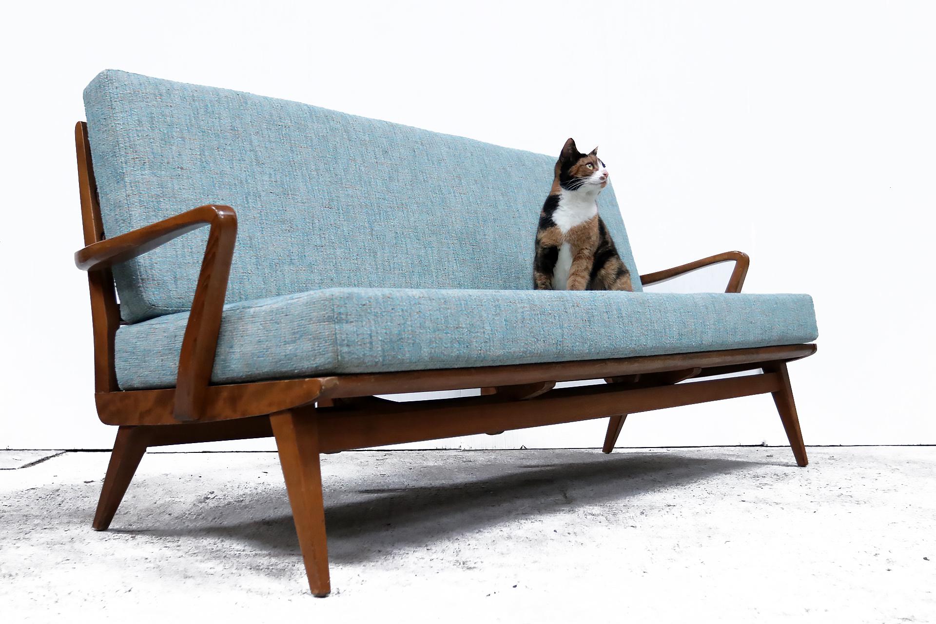 Stunning vintage design sofa made by the German company Casala in the 1960s.
Beautiful slim design and a very comfortable seat.
The pillows are newly upholstered and are removable.
Beautiful thick fabric in a light blue green color.
  