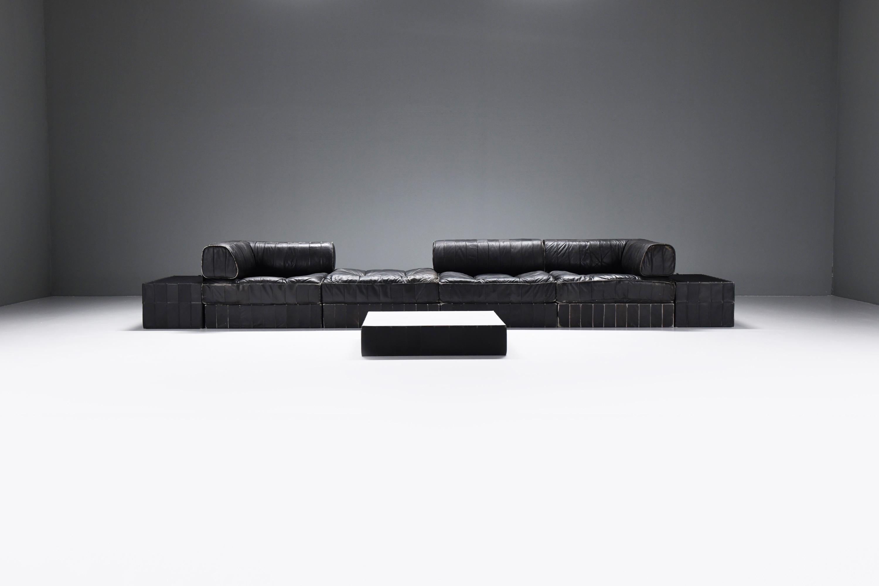 Wonderful, patinated & modular patchwork DS-88 sofa.  Still 100% original and in a perfect black leather.
Designed by Team De Sede for De Sede Swiss.

A timeless masterpiece designed and manufactured by De Sede, Switzerland 1970s. Crafted with