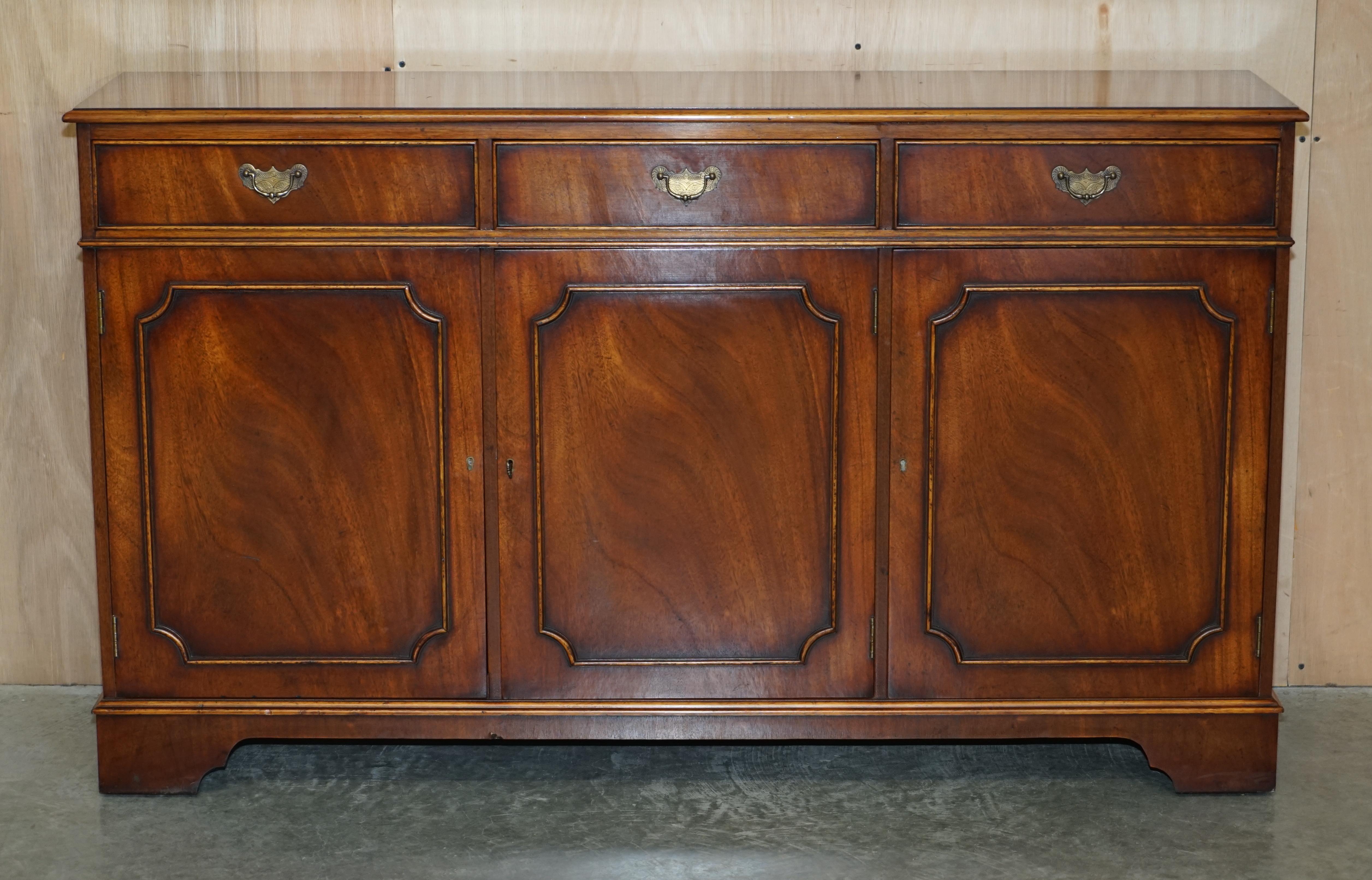 We are delighted to offer for sale this exquisite, Flamed Mahogany sideboard with three large drawers to the top and bookcase shelves inside 

A very good looking and well made piece, this is basically art furniture, the grain of timber in the