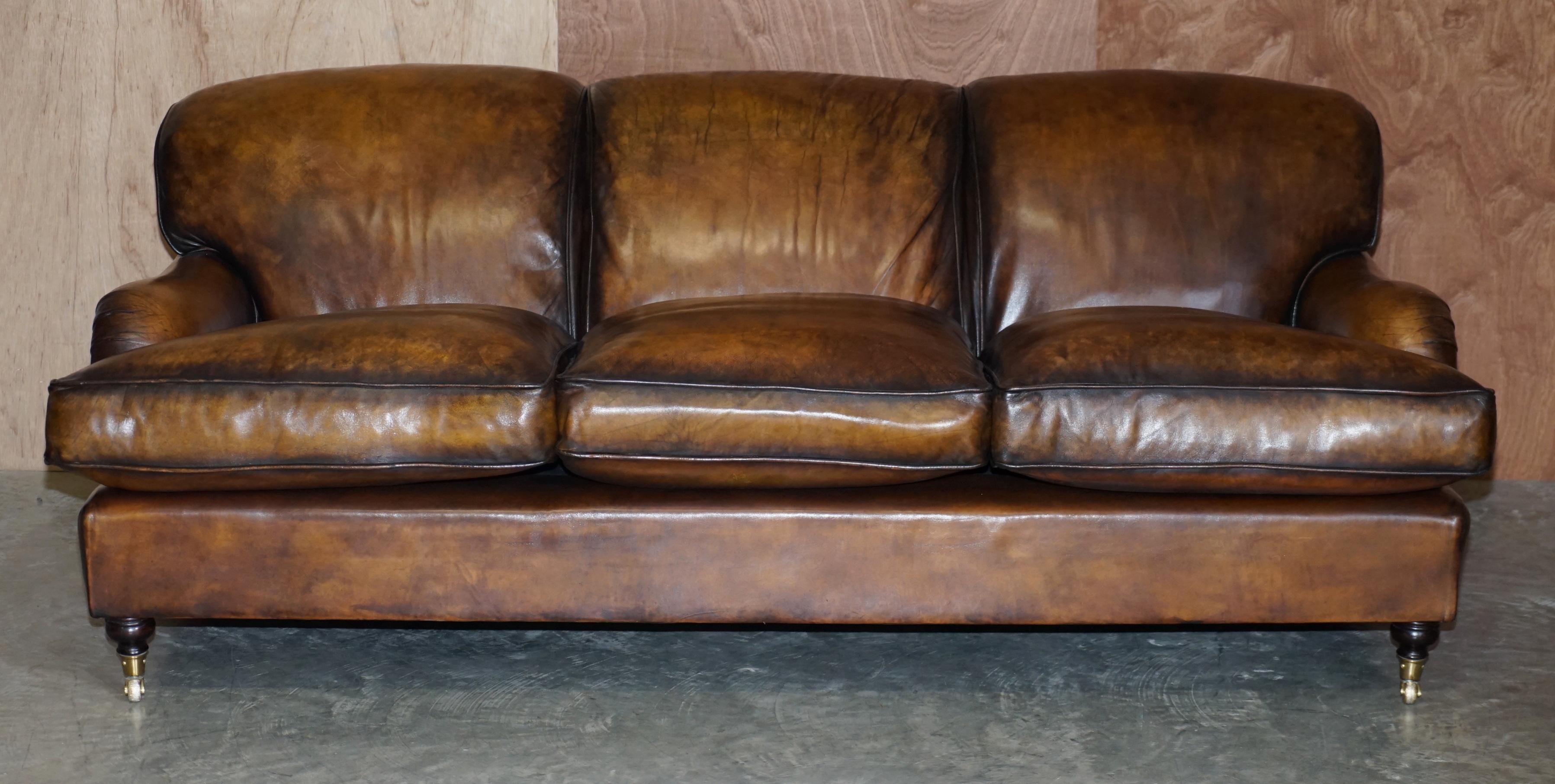 We are delighted to offer for sale this lovely vintage fully restored hand dyed brown leather Howard & Son’s style three seat sofa with overstuffed feather filled cushions

I have a matching two seat sofa which is with the restorers now and should