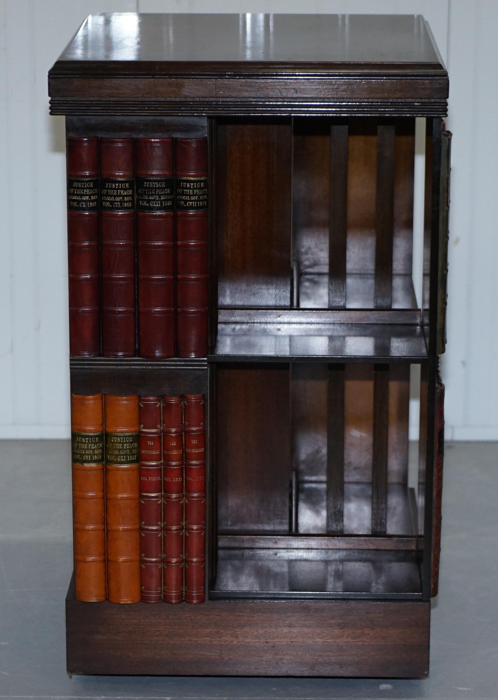 We are delighted to offer for sale this stunning vintage solid flamed mahogany revolving carousel swivel bookcase on wheels

A very rare find with the faux books in place, reminiscent of the Gillow’s kidney desk that has the faux library to the