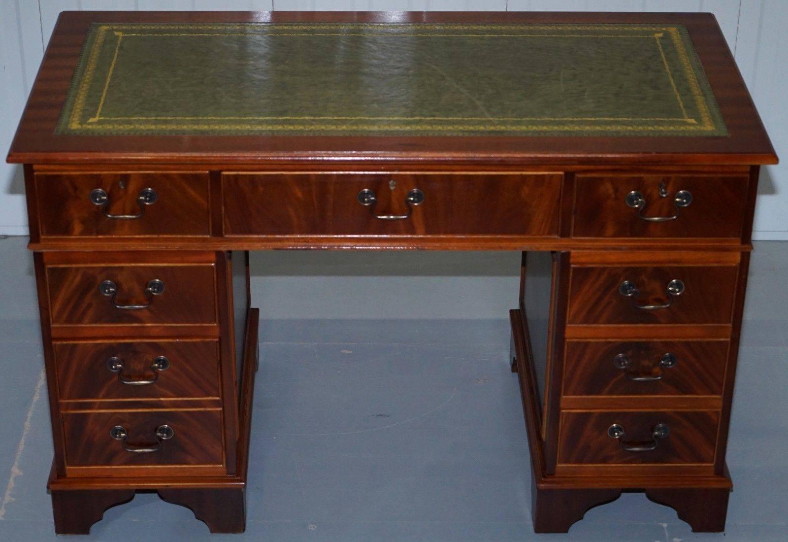 We are delighted to offer for sale this stunning vintage twin pedestal partner desk finished in luxury flamed mahogany and with a green leather tooled edge surface

A very good looking and well-made desk with a lovely timber patina, 

In terms