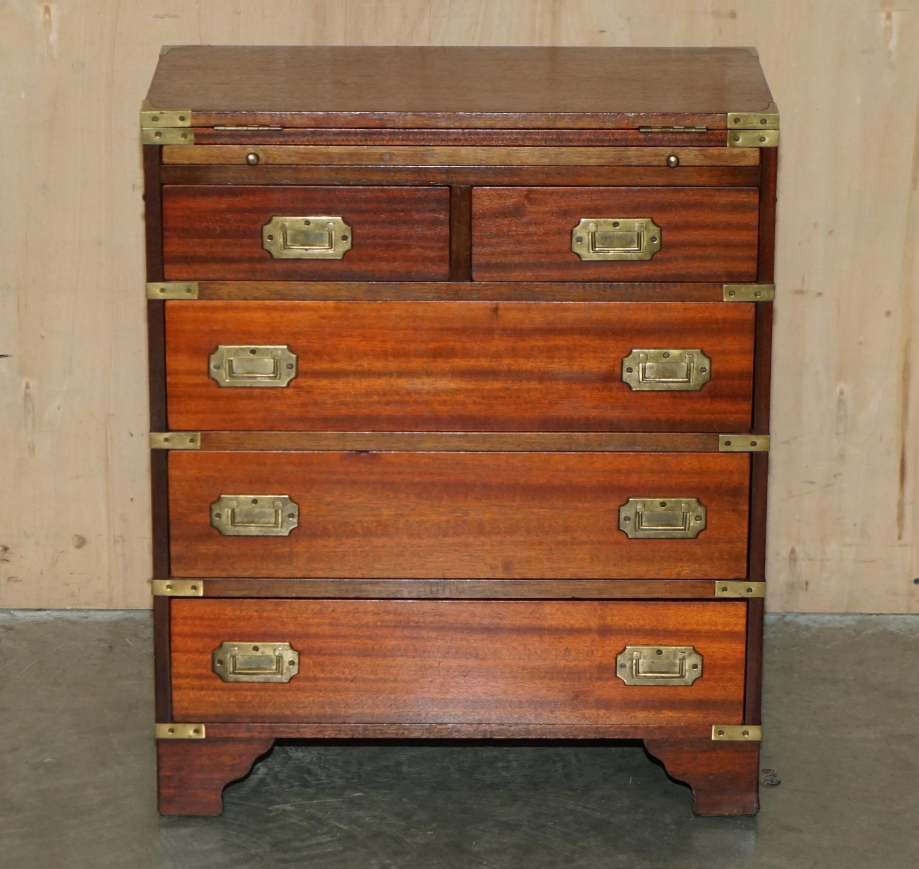 Royal House Antiques

Royal House Antiques is delighted to offer for sale this sublime Vintage hand made in England Military Campaign chest of drawers with Butlers slip serving tray and extending top

Please note the delivery fee listed is just a