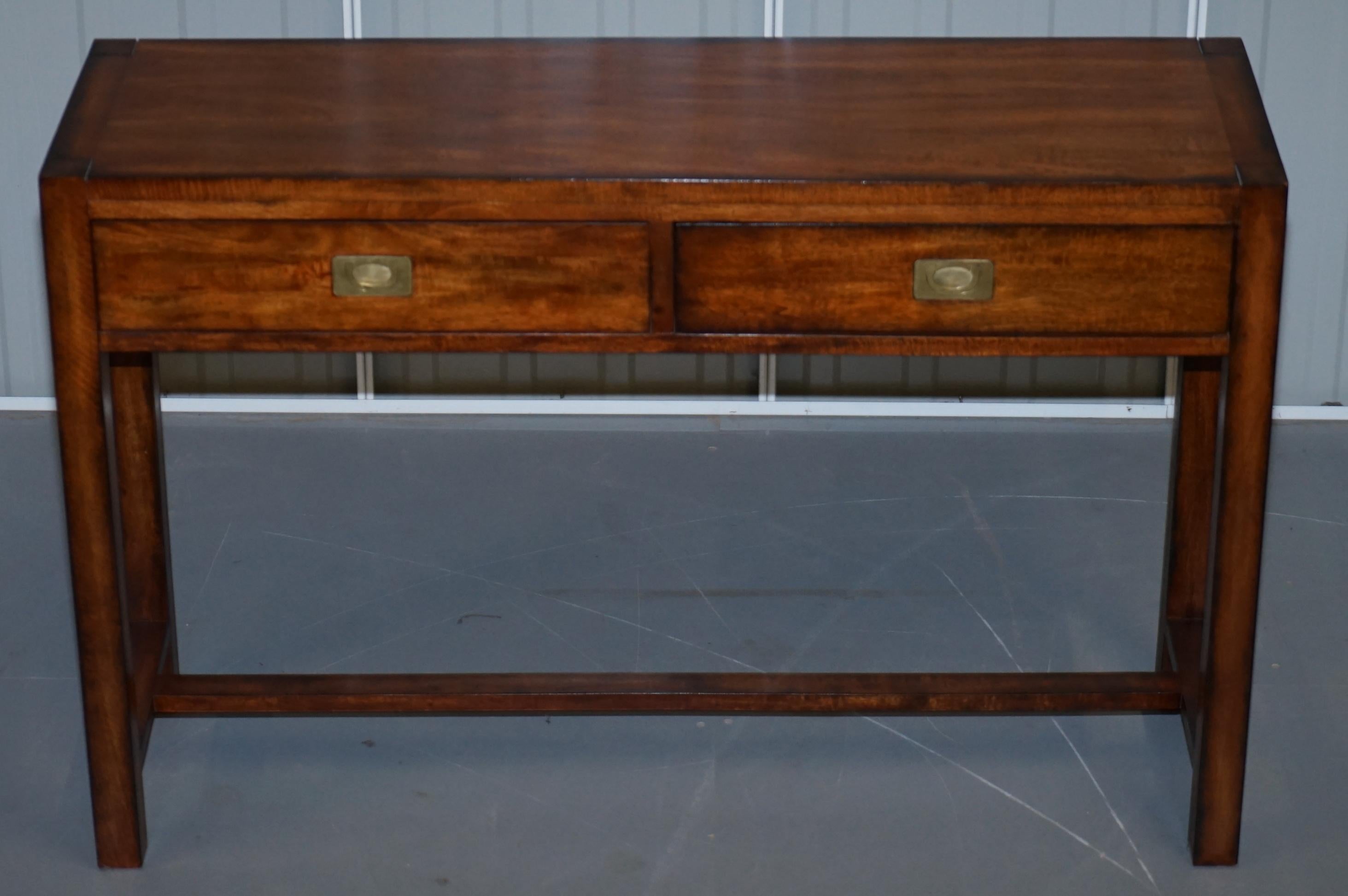 We are delighted to offer for sale this lovely vintage Military Campaign style console table with single drawer

Made from solid mahogany and with bronzed metal hardware.

We have cleaned waxed and polished it, there will be the odd patina mark