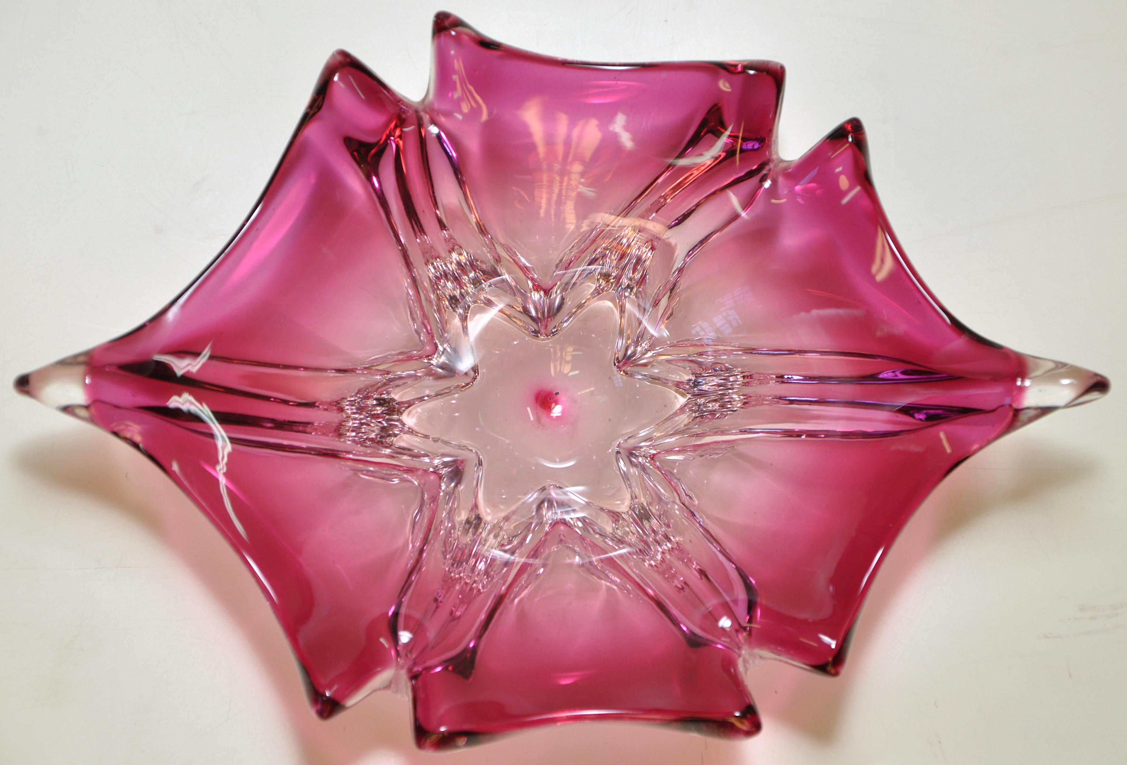 Stunning Vintage Pink Art Glass Bowl Italian 

A stunning vintage piece of art glass in a strong pink. This piece is wonderful as it would look great matched with antique or Mid-Century Modern furniture and yet it would fit perfectly into a