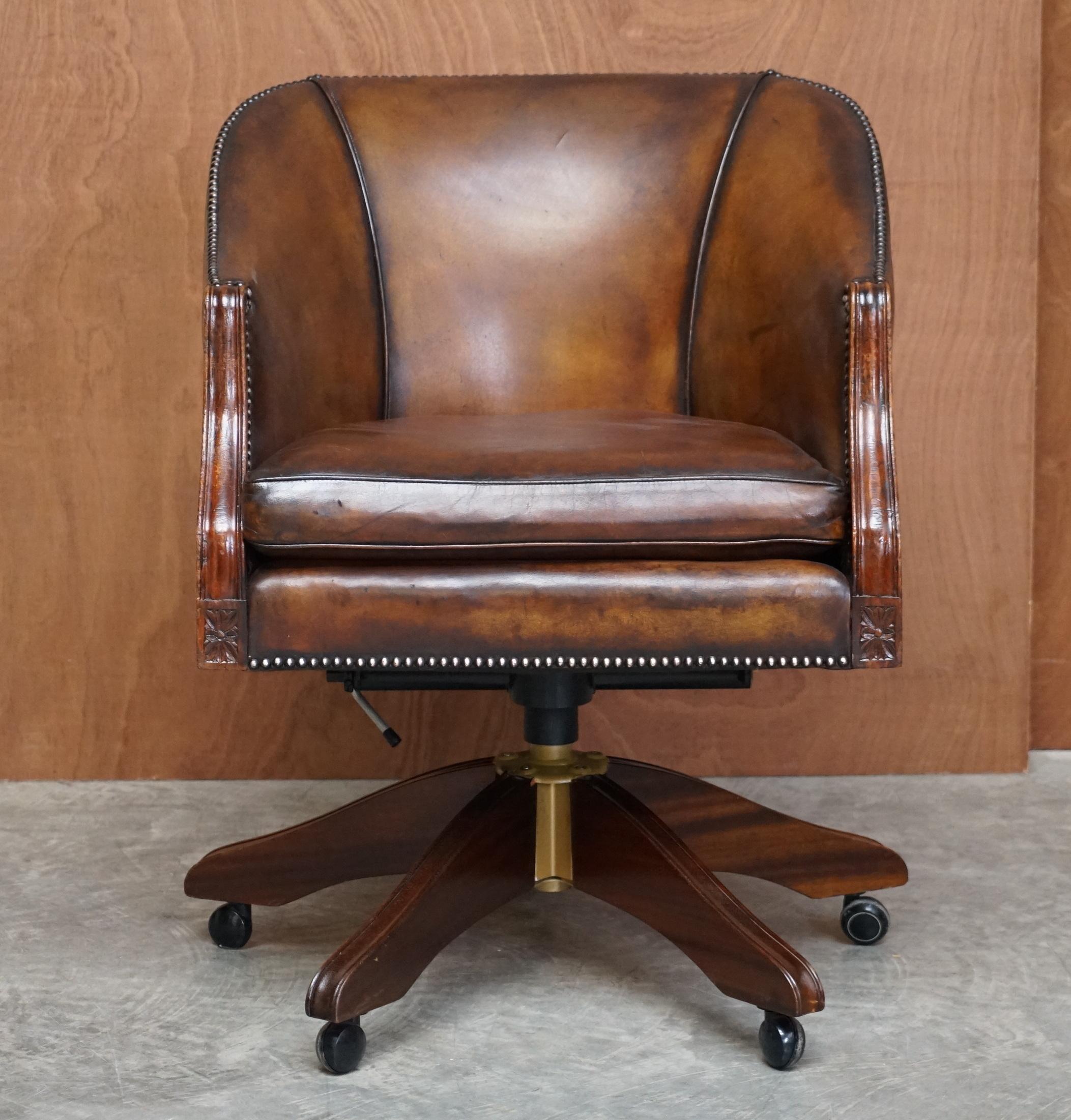 We are delighted to offer for sale this fully restored vintage Barrell back hand dyed brown leather office chair.

This chair is really quite exquisite, the frame is solid beech, the leather lovely thick English hide, the base swivels and it has