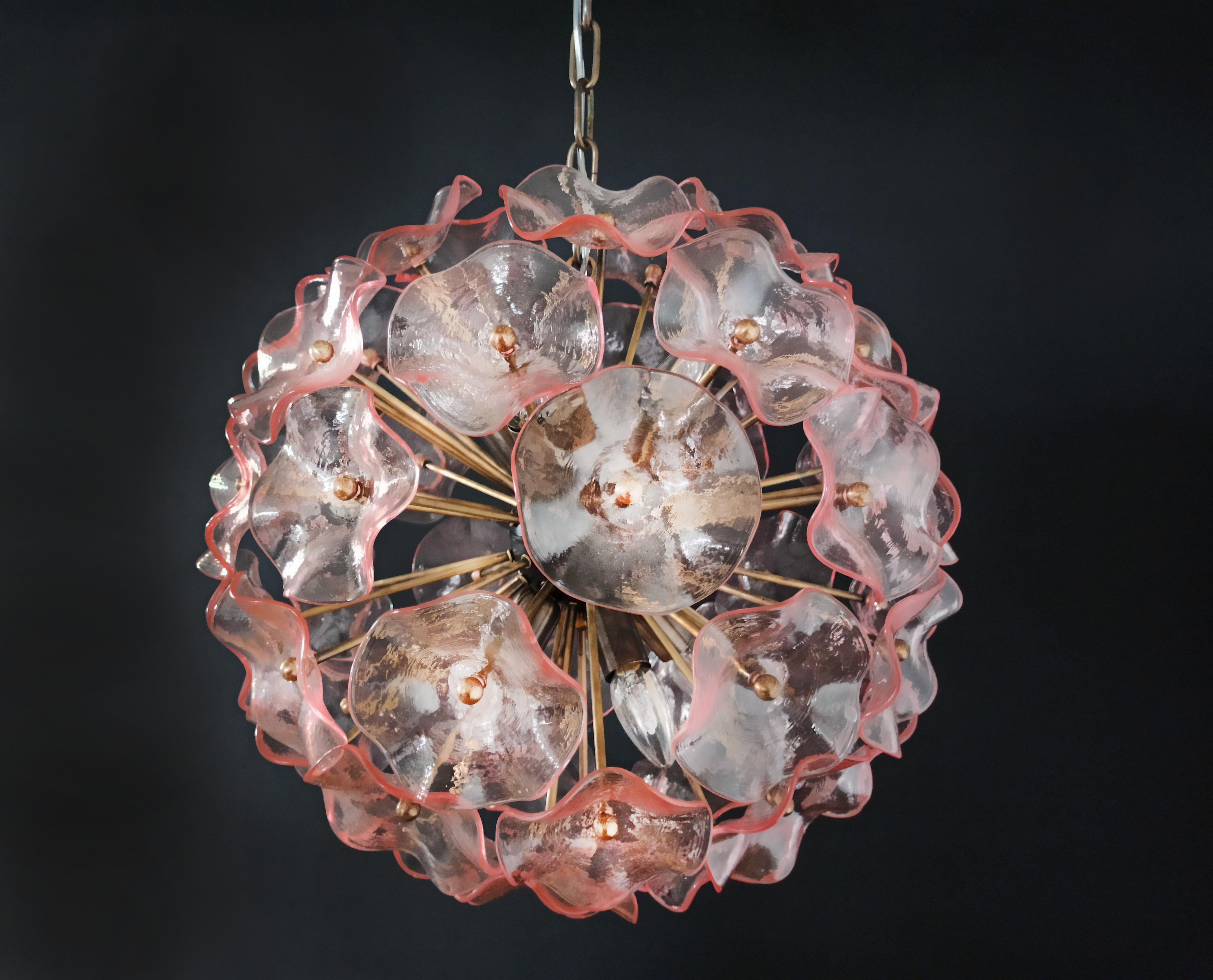 Amazing Sputnik Italian vintage crystal chandelier made by 51 pink crystals in a burnished brass metal frame.
Period: 1970’s / 1980's
Dimensions: 41,30 inches (105 cm) height with chain; 17,70 inches (45 cm) height without chain; 19,70 inches (50