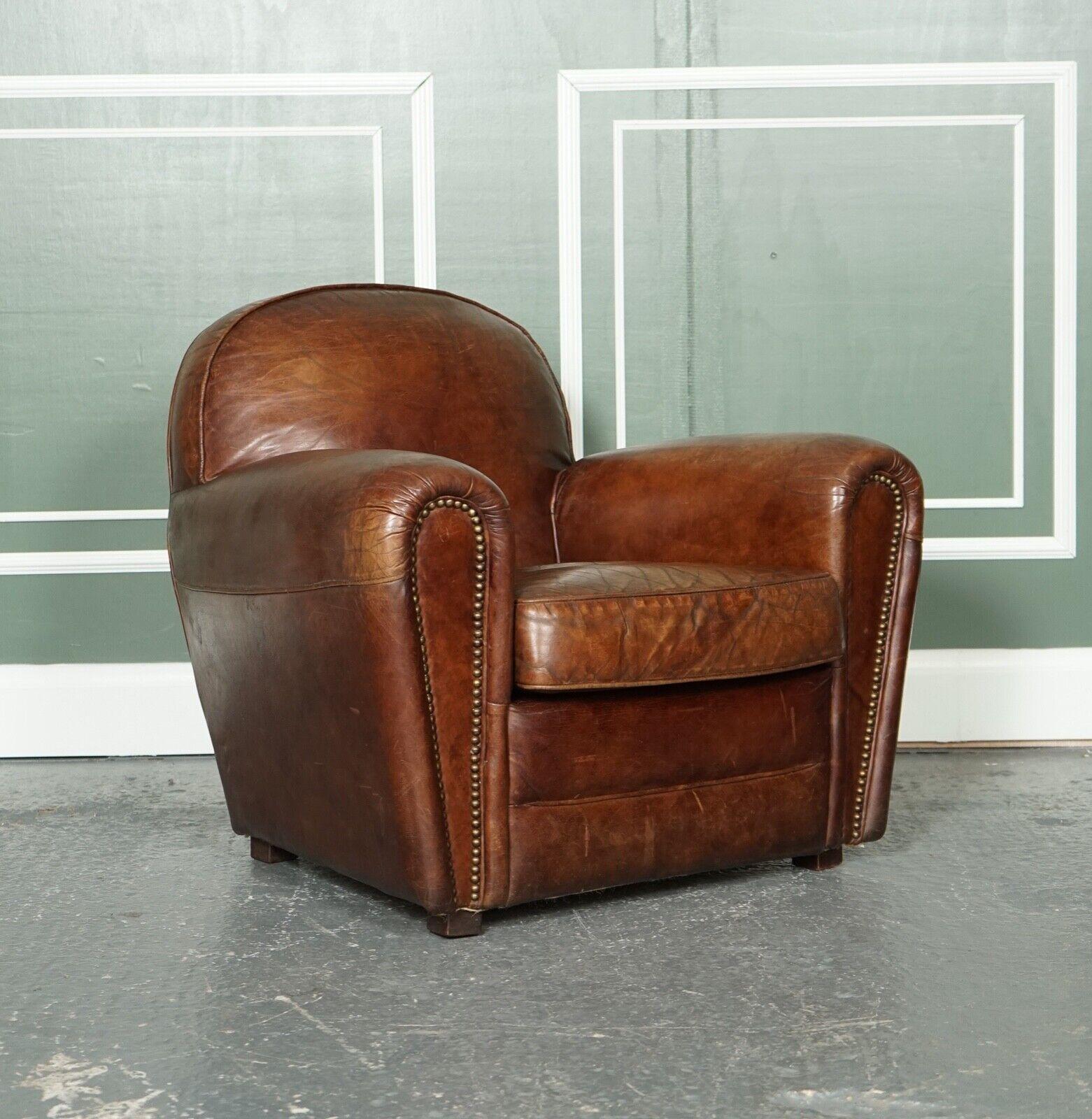 We are so excited to present to you this lovely Timothy Oulton hand-crafted leather club armchair.

Very stylish armchair and absolutely comfortable.
The leather has aged very well and left the expected patina all over.
We have recovered the