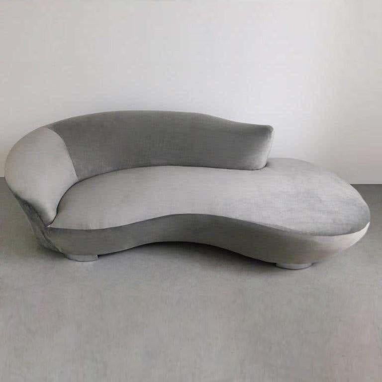 This gorgeous biomorphic shape sofa has been fully restored in grey velvet. It's unique shape and curved chrome feet give the sofa a wonderful floating effect.