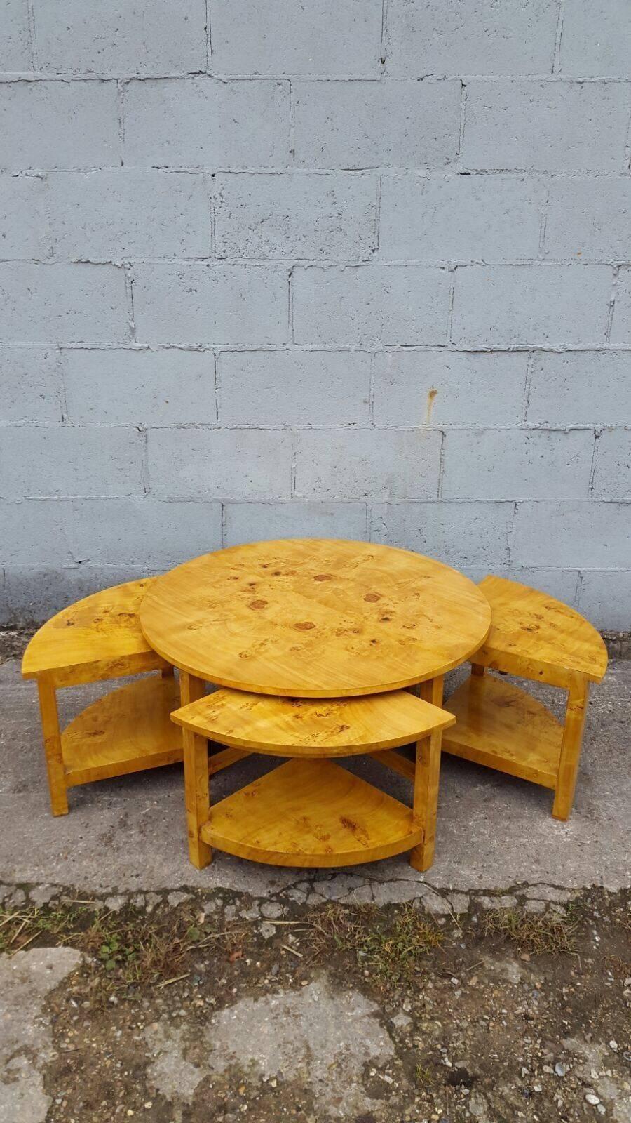 A stunning Art Deco style contemporary coffee table that also has four separate tables that pull out, in beautiful walnut veneer. 

Very hard to come by, especially in this condition. 

















 