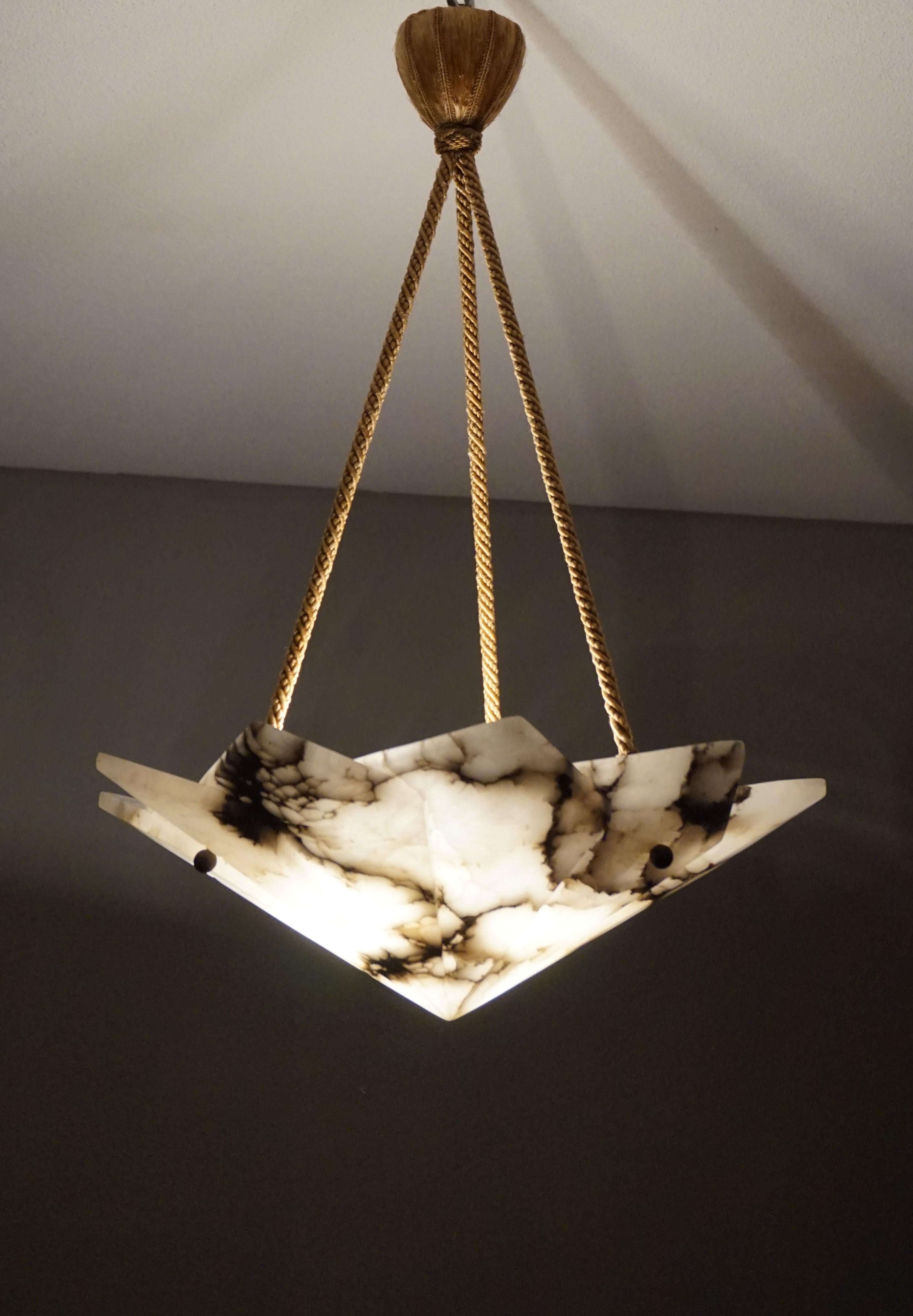 Geometrically designed, three light Art Deco alabaster pendant.

With early 20th century lighting as one of our specialities, we were thrilled to find this rare and truly Art Deco alabaster pendant. They are almost always circular in shape and you