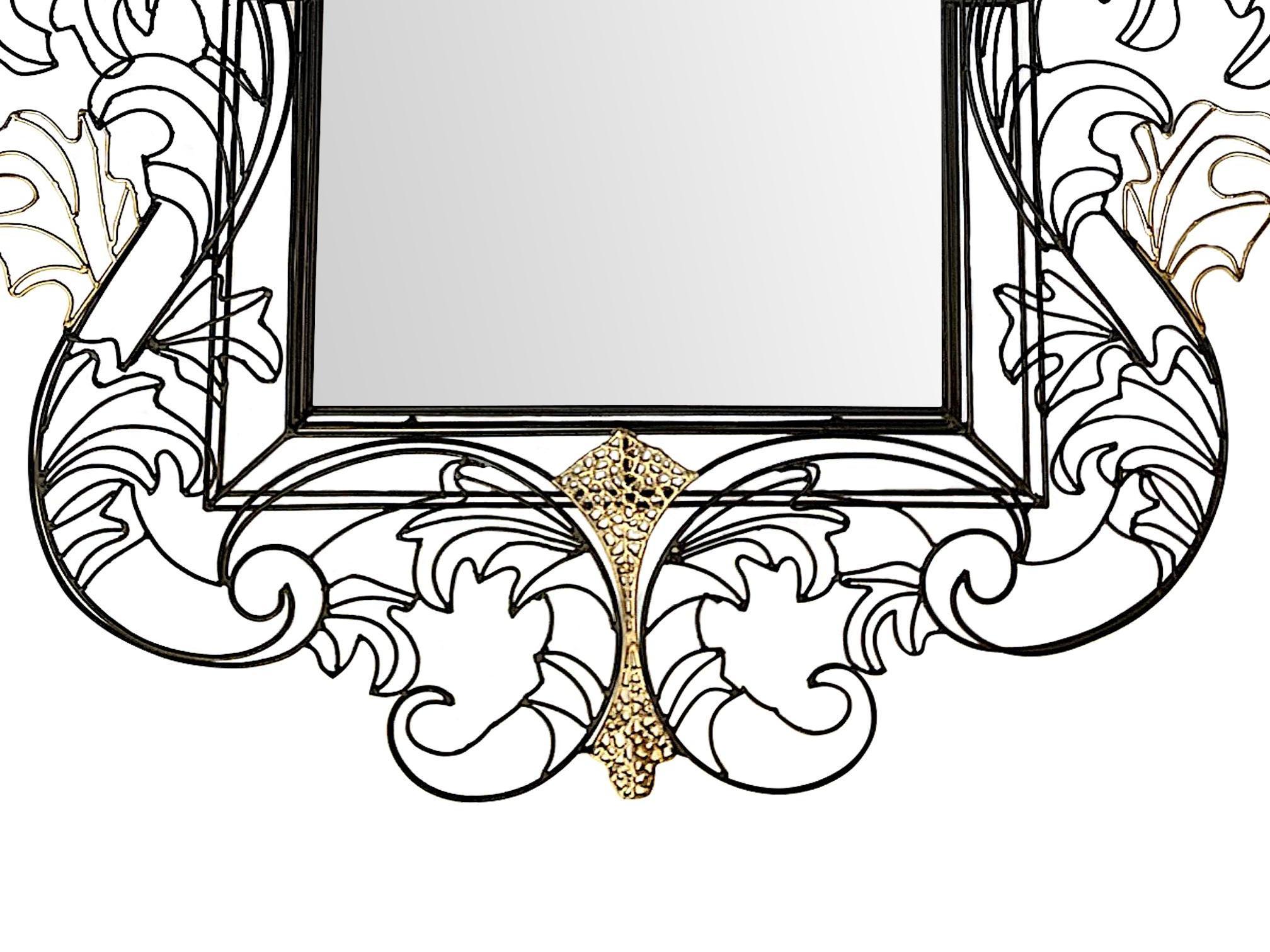 A stunning ornate wire framed mirror by Anacleto Spazzapan with stylised Rococo design around a central mirror finished in black and gold. 

  