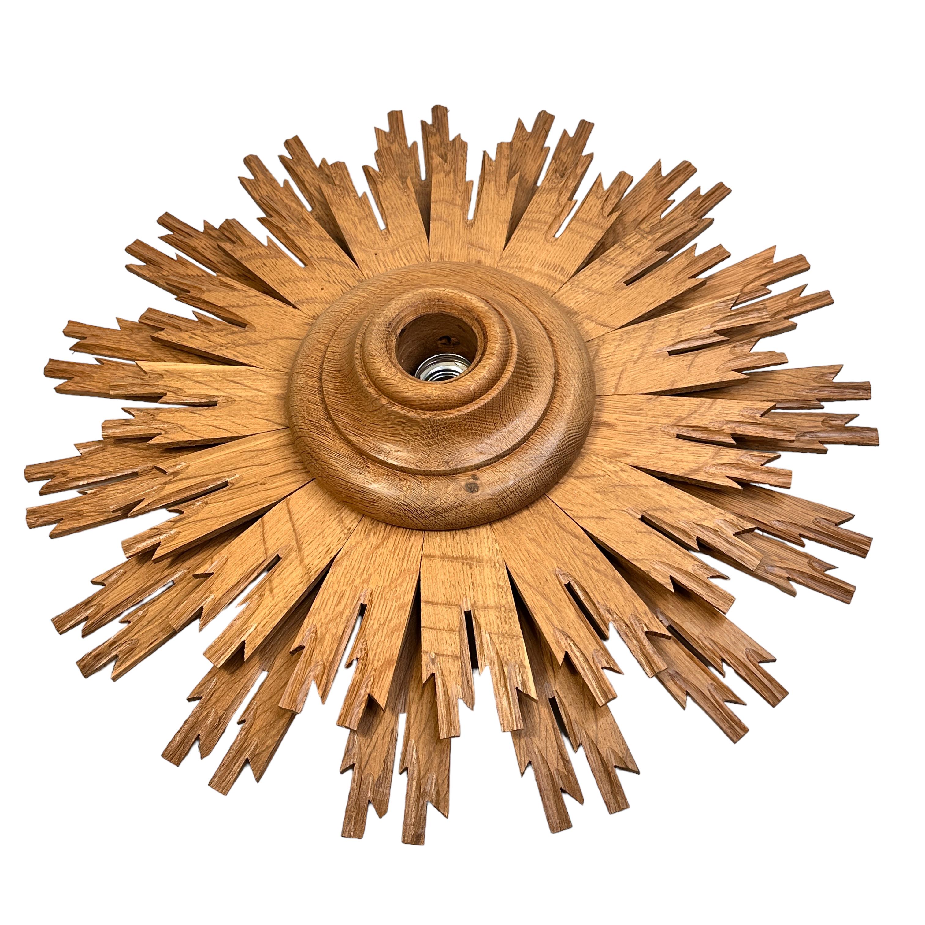 Beautiful wooden handcrafted flush mount. Made in Germany by a wood worker. Gorgeous sunburst starburst flush mount with one single light. The fixture requires one European E27 / 110 Volt Edison bulb, up to 60 watts. You can also use it as wall