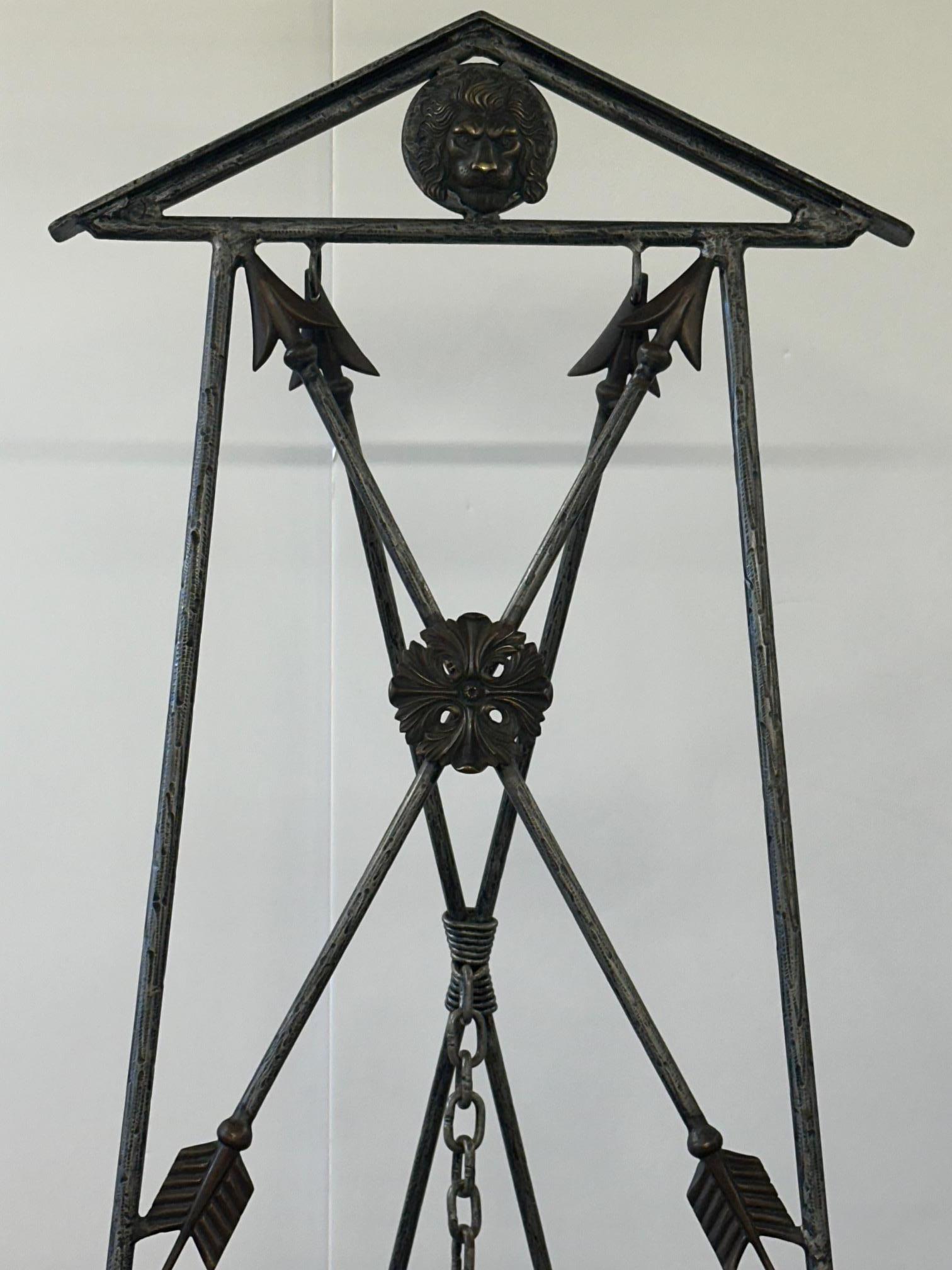 Impressive wrought iron neoclassical style easel with brass accents having arrows, lion heads and beautiful cartouche decoration.
28” h to shelf to hold art