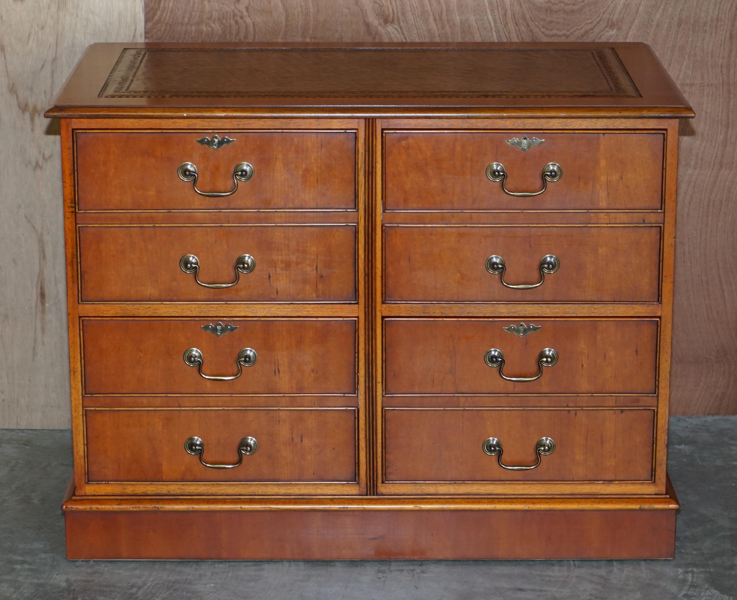We are delighted to offer this exquisite quad drawer yew wood brown leather topped double bank filing cabinet

A good looking and well made piece, ideally suited for an office or library setting but can of course be used for a living room pedestal