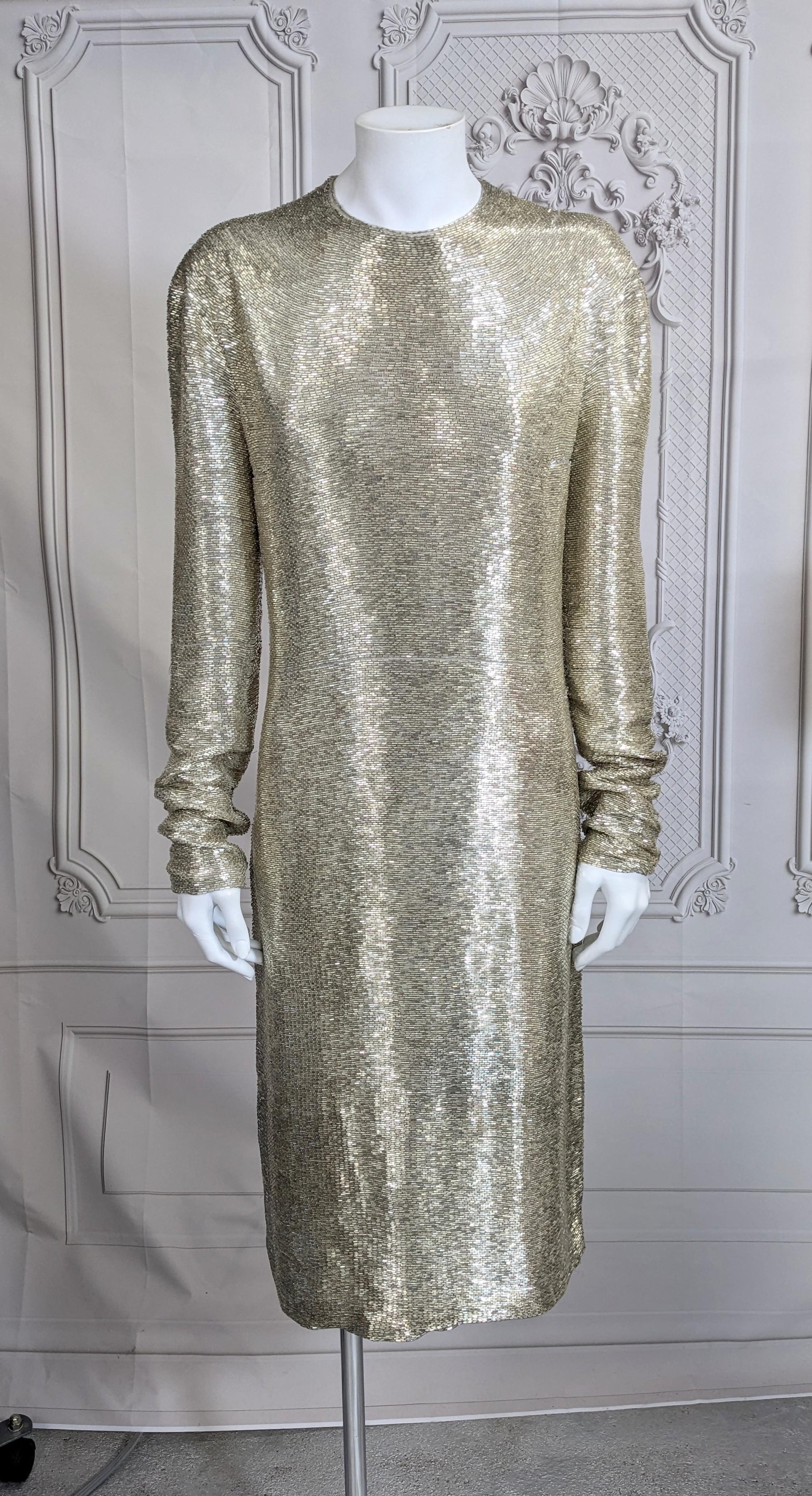 Stunning Yves Saint Laurent by Alber Elbaz Fully Bugle Beaded Sheath from the 2000's. Simple yet elegant cut as a hand embroidered liquid pour of east-west silvered bugle beads. Strong shoulder with slim body conscious fit. Beads are beautifully