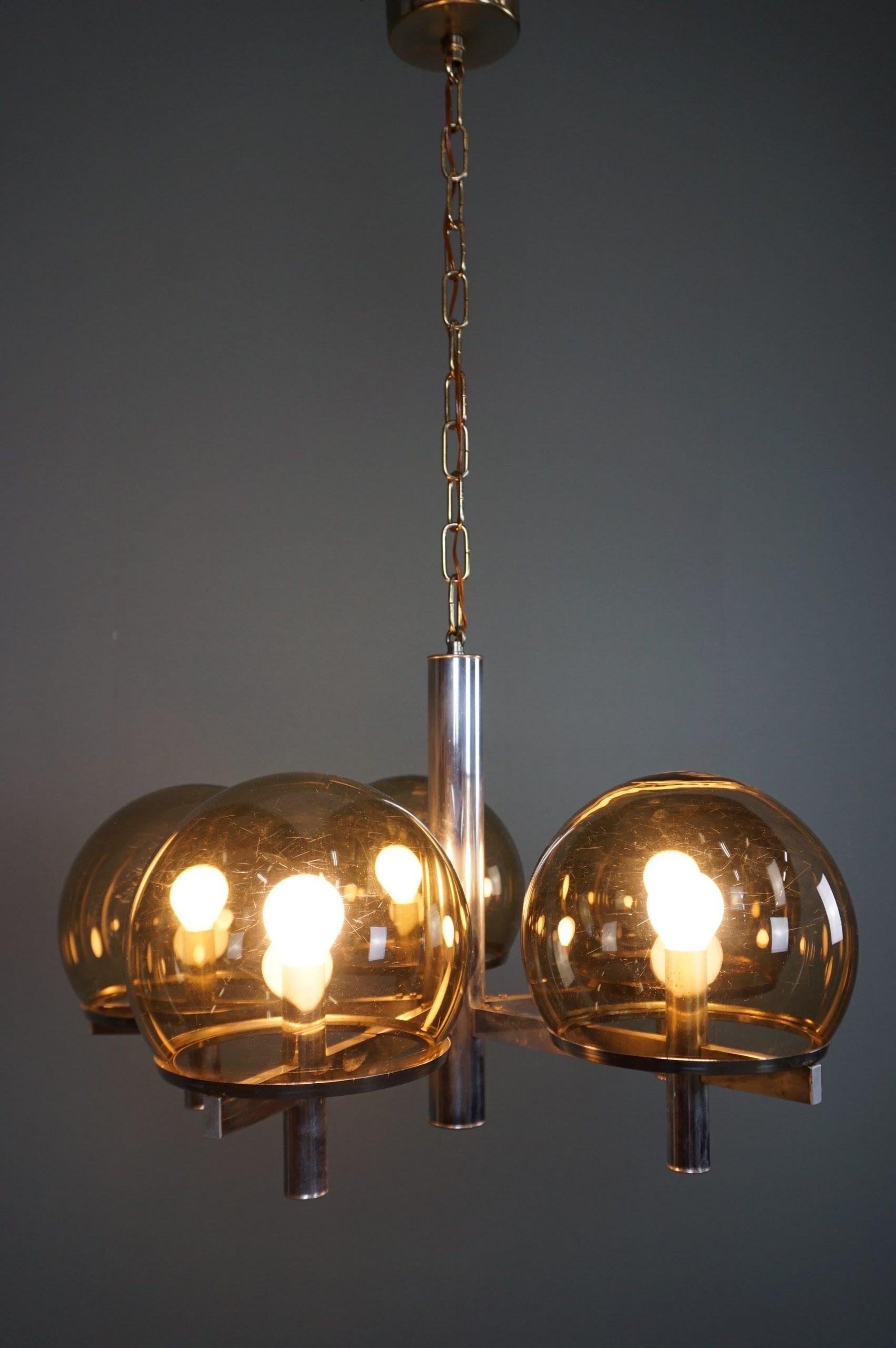 Offered is this striking hanging lamp designed by Gaetano Sciolari.

This timeless chandelier has a beautiful appearance due to the combination of the chrome frame with the smoked glass balls. Gaetano Sciolari lamps always impress us with their