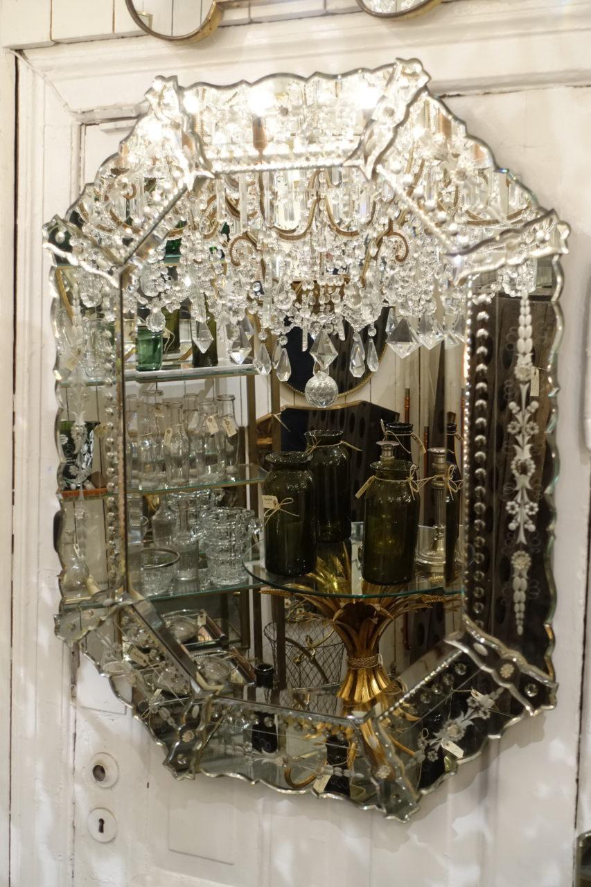Beautiful vintage Venetian mirror, with pretty faceted mirrored glass frame, and wonderful etched handiwork in the decorative floral and foliage designs. Note the frame's stunning form.