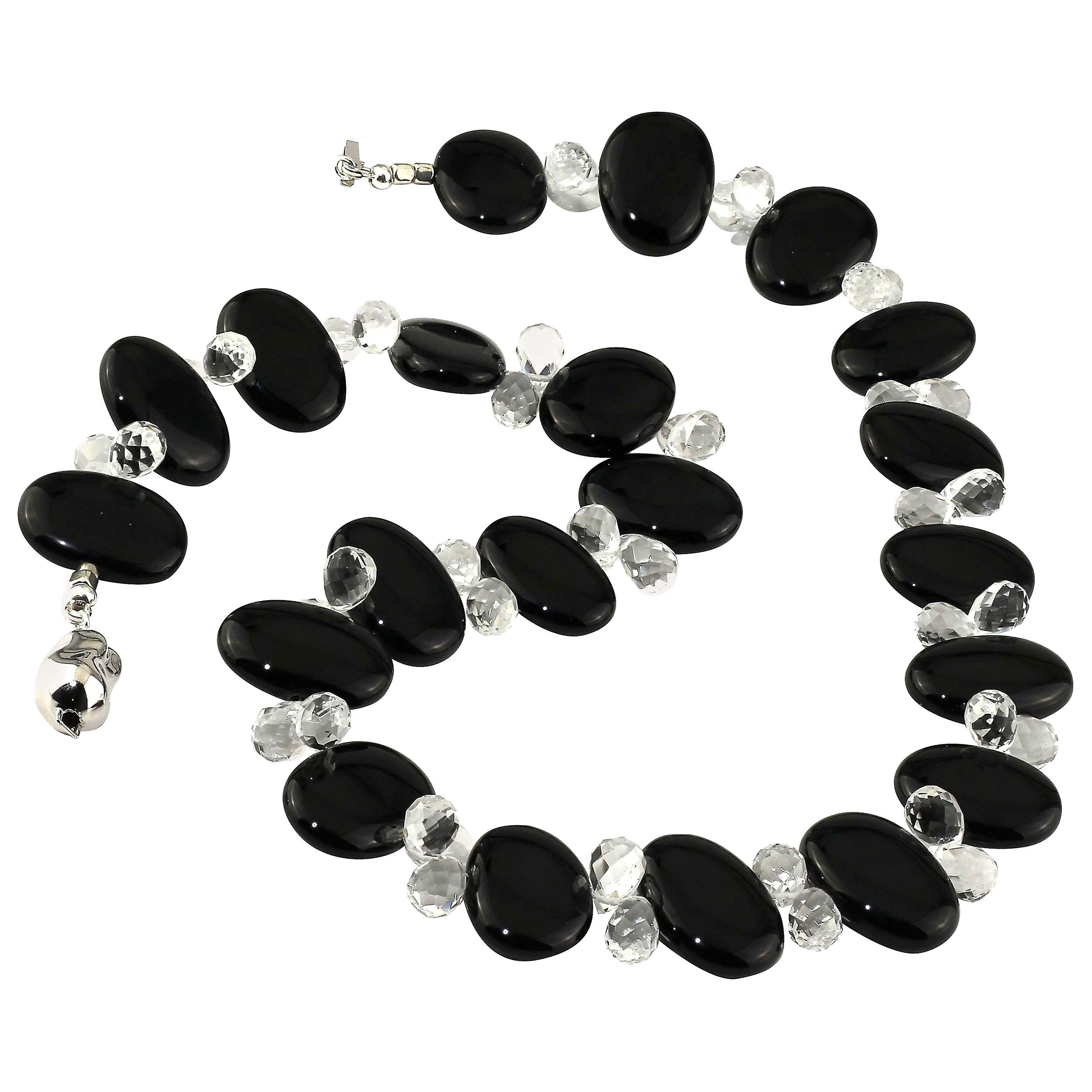 Unique necklace of handcrafted Black Onyx oval tablets, 24 x 17 MM, and clear Quartz Crystal briolettes, 10 x 7 MM.  These highly polished Black Onyx tablets are almost mirror like.  The sparkling, overall faceted Quartz Crystal briolettes dance and