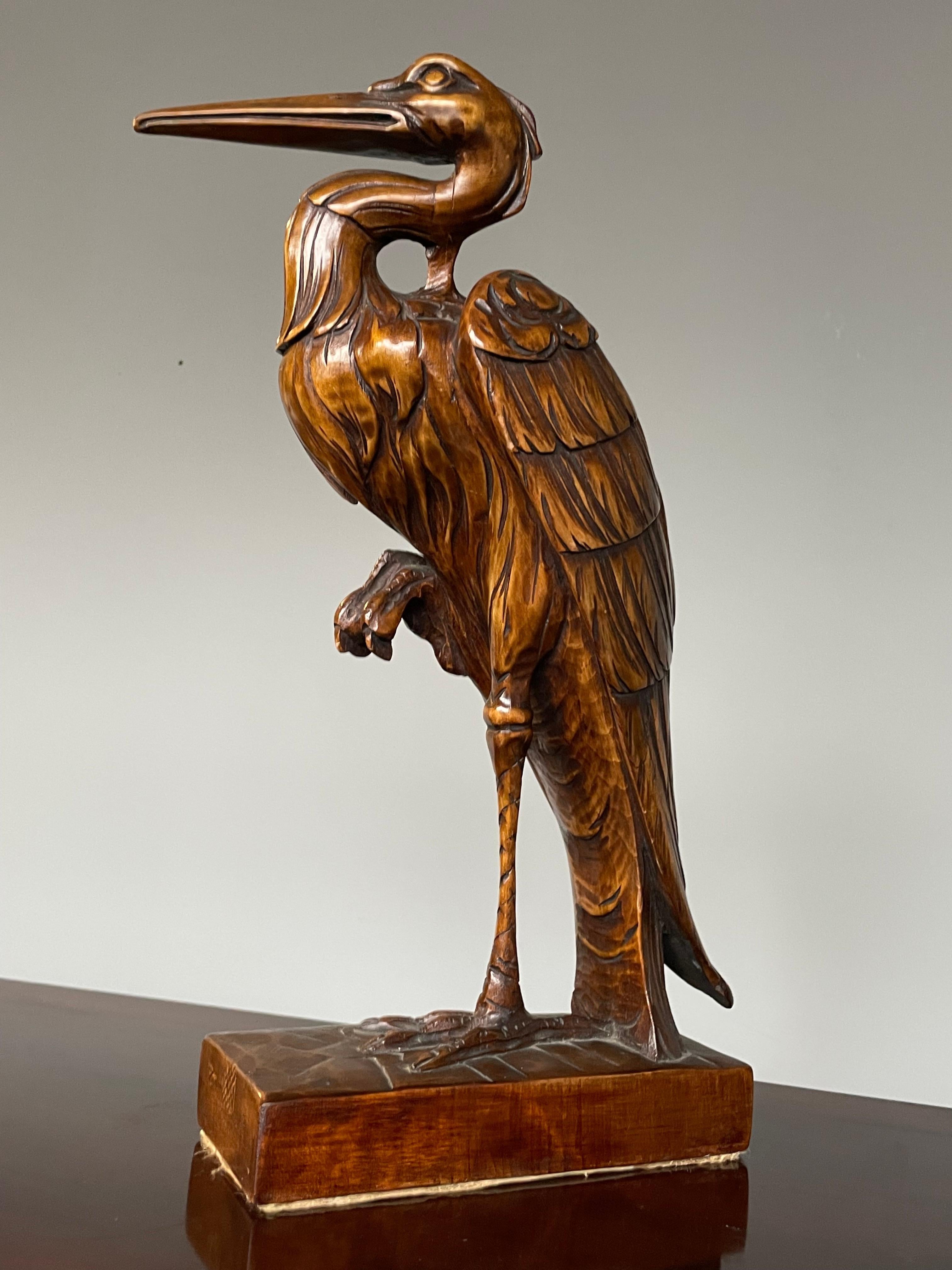 hand carved wooden pelicans