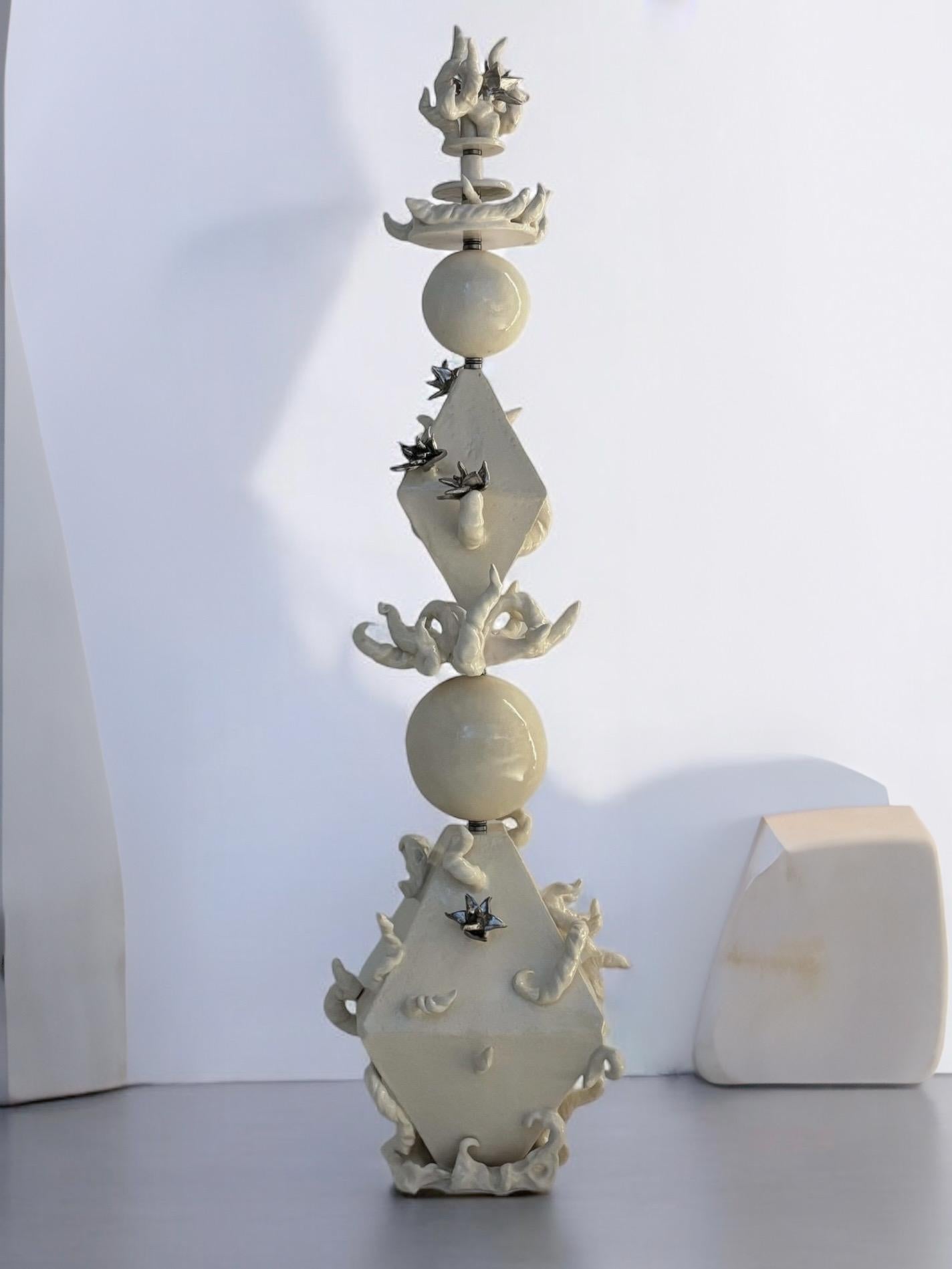 Stupa Dve Sculpture in White Glazed Ceramic & Steel by Lucile Rebeirot
Dimensions: D 40 x W 40 x H 142 cm. 
Materials: Glazed ceramic, platinum, steel, and ball bearings.

Available in different finish options. Please contact us.

The stupa, a