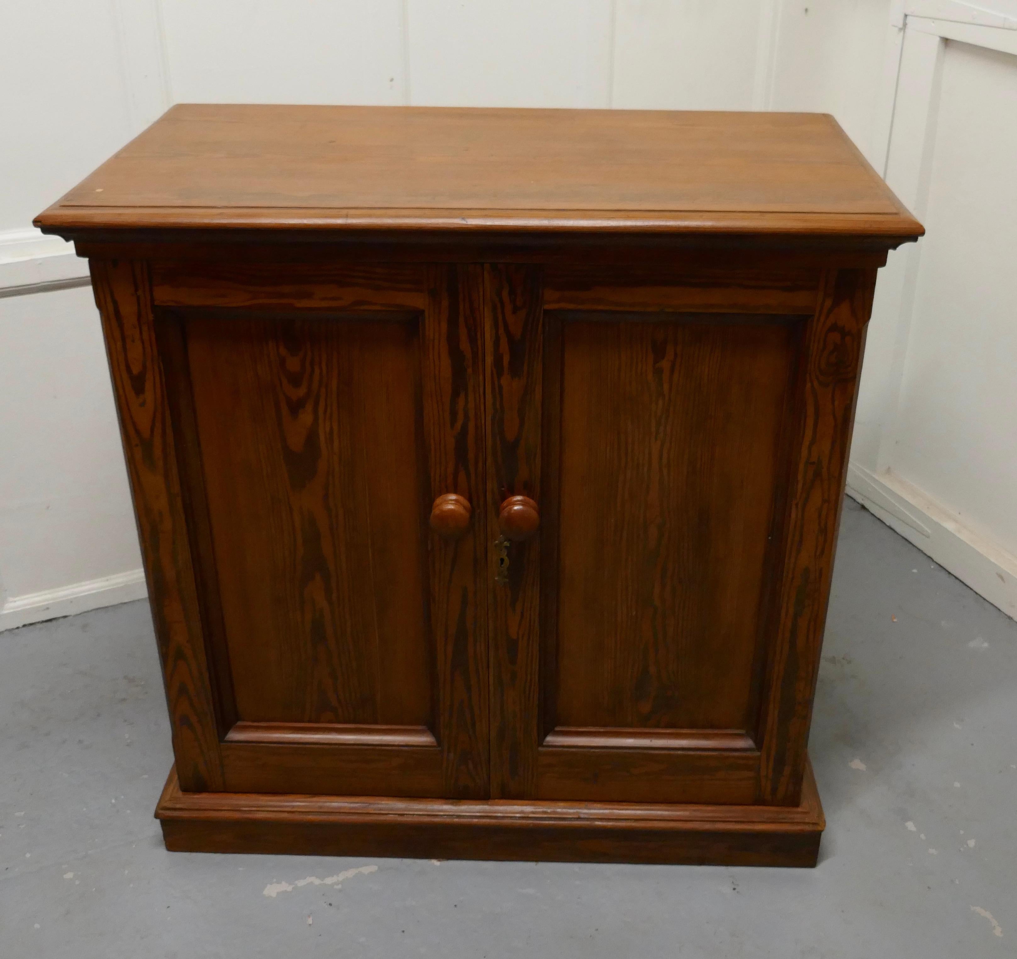 Sturdy 19th century pitch pine 2-door cupboard

This roomy cupboard is made throughout in beautiful pitch pine it has paneled doors, moulded top and it stands on a neat plinth 
 
The cupboard has one adjustable shelf to the inside
The cupboard