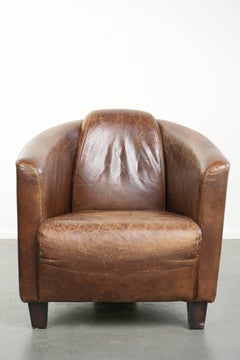 Poltrona dal design "Aviator" in robusta pelle di vacchetta color cognac