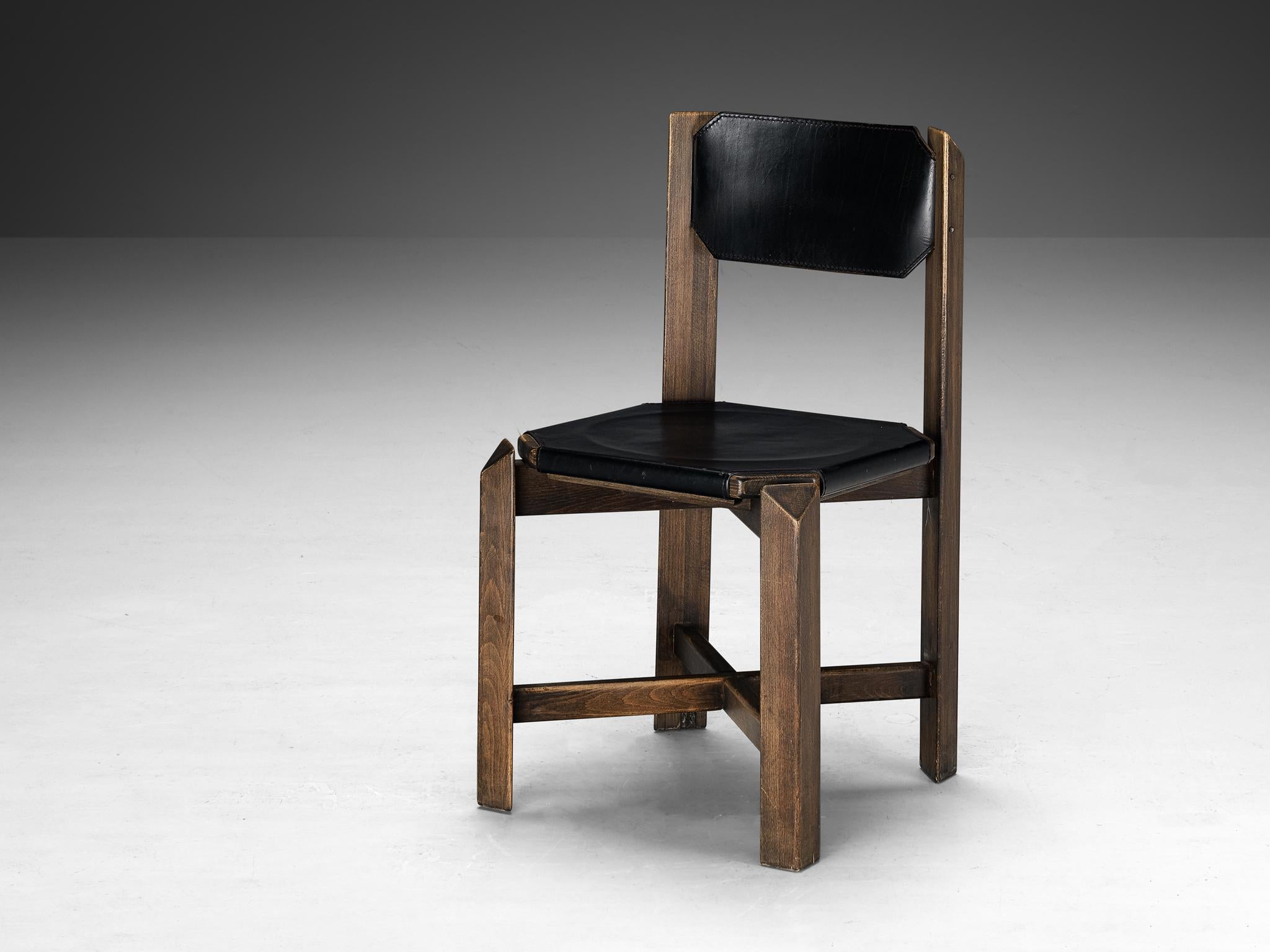 Dining chair, leather, beech, Europe, 1970s

This design shows a sturdy construction, featuring durable black leather upholstery complemented by a robust wooden framework. The architectural design showcases precise attention to detail, with linear