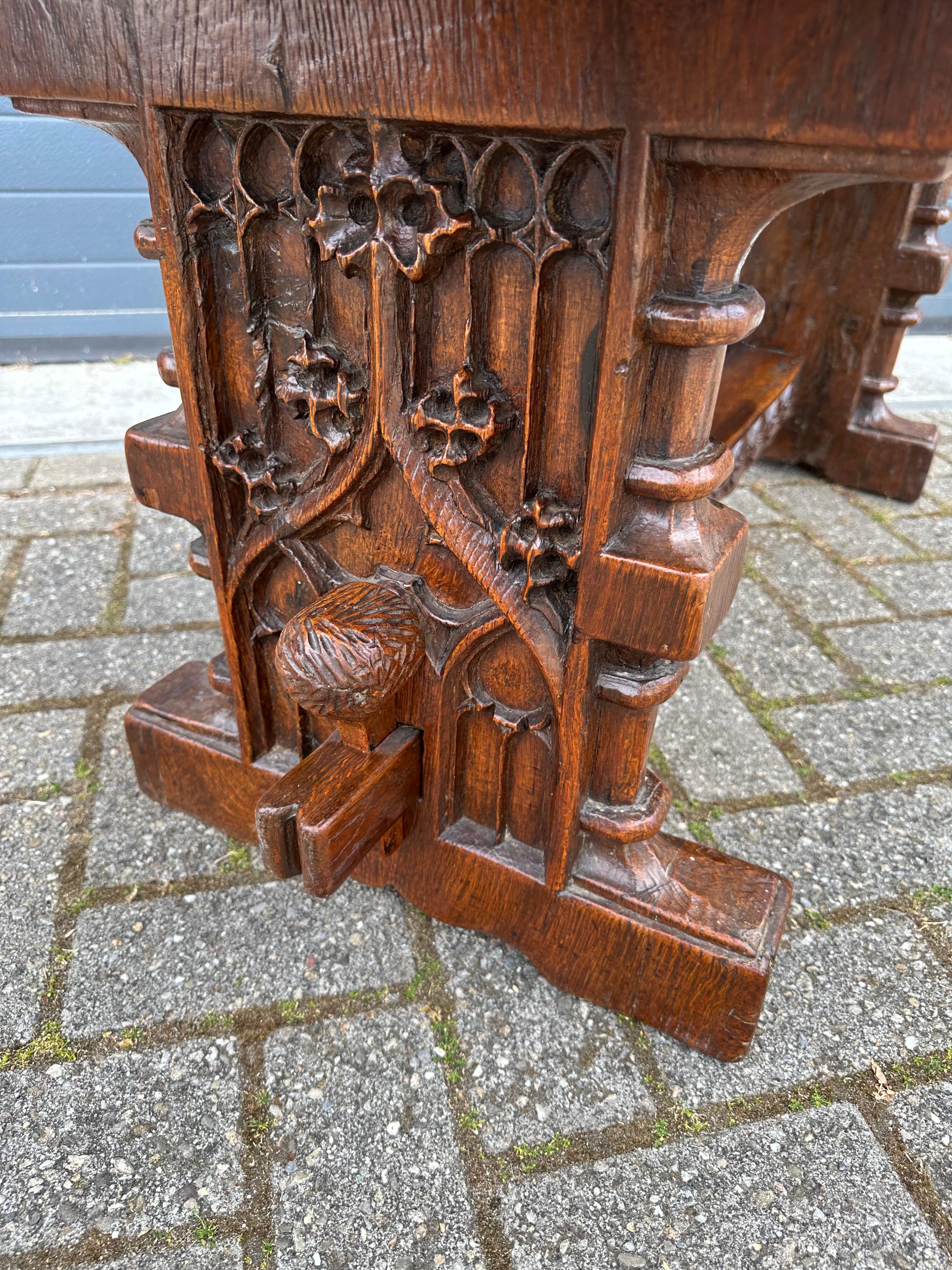 Stunning antique Gothic design, coffee or side table.

This wonderfully bulky table really is of an impressive quality make and it also is practical in size. It comes with deep and beautiful, hand carved Gothic elements all around. It is not made