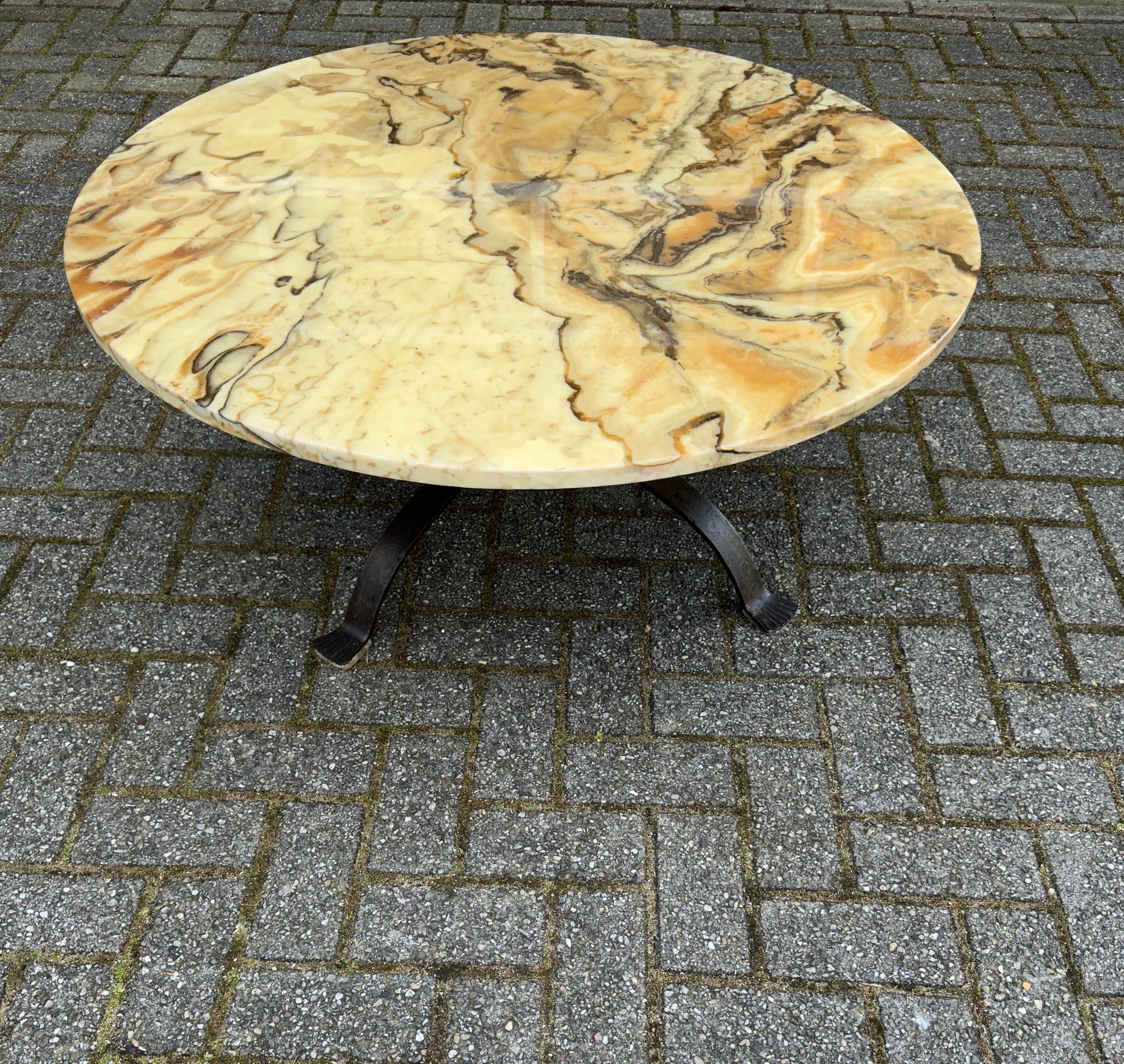 Great size, practical and very decorative round table.

This beautiful quality coffee or large size end table is made of natural materials only and you could not wish for a more durable specimen. The hand forged, wrought iron base is perfect for