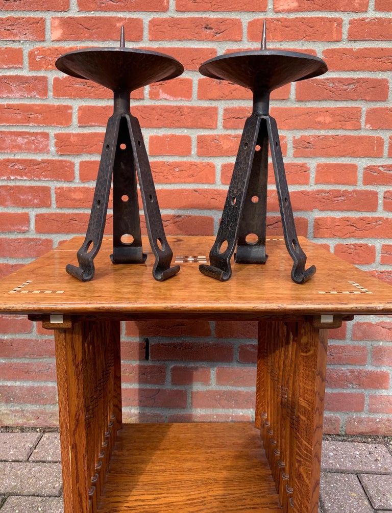 Stylish and very strong pair of timeless candle sticks.

If you are looking for beautiful Arts & Crafts antiques to grace your living space then this hand-crafted and timeless pair could be yours to own and enjoy soon. They are truly stylish,