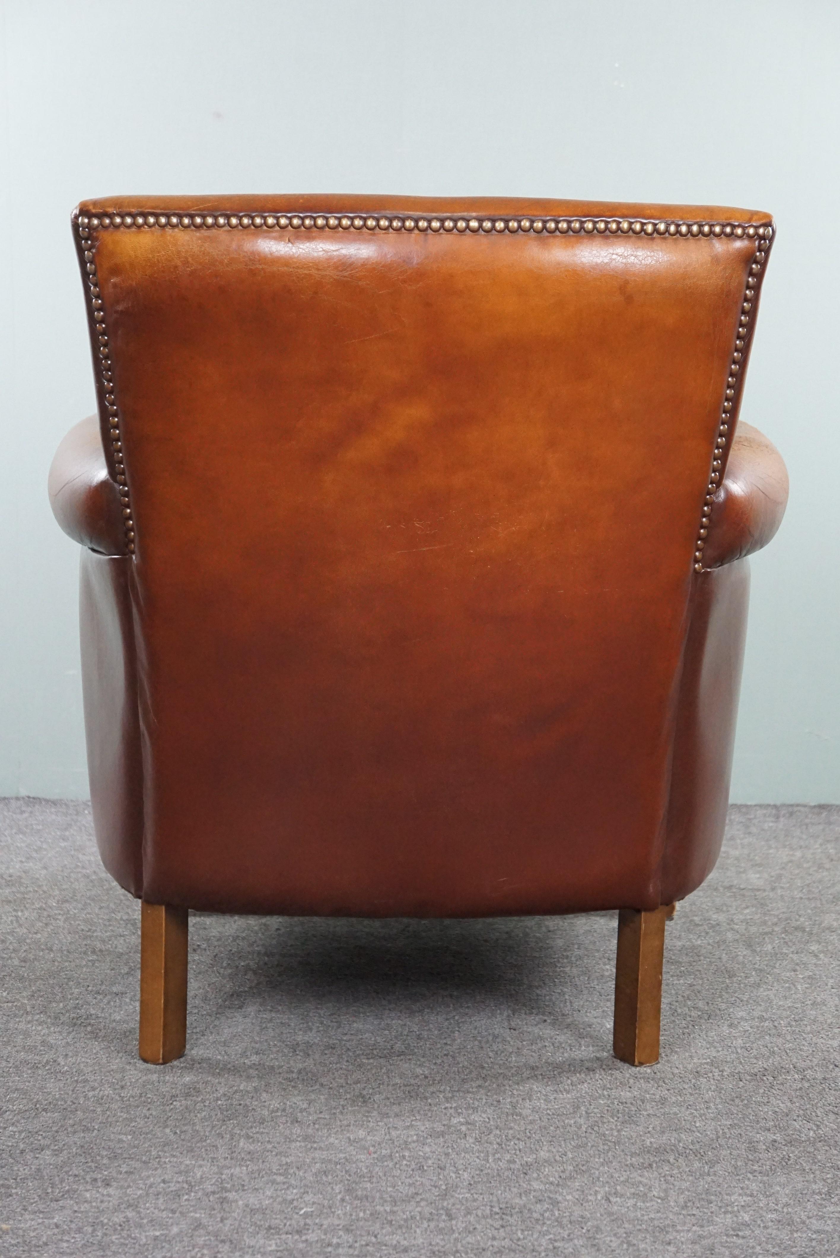 Late 20th Century Sturdy sheep leather armchair with a distressed look For Sale