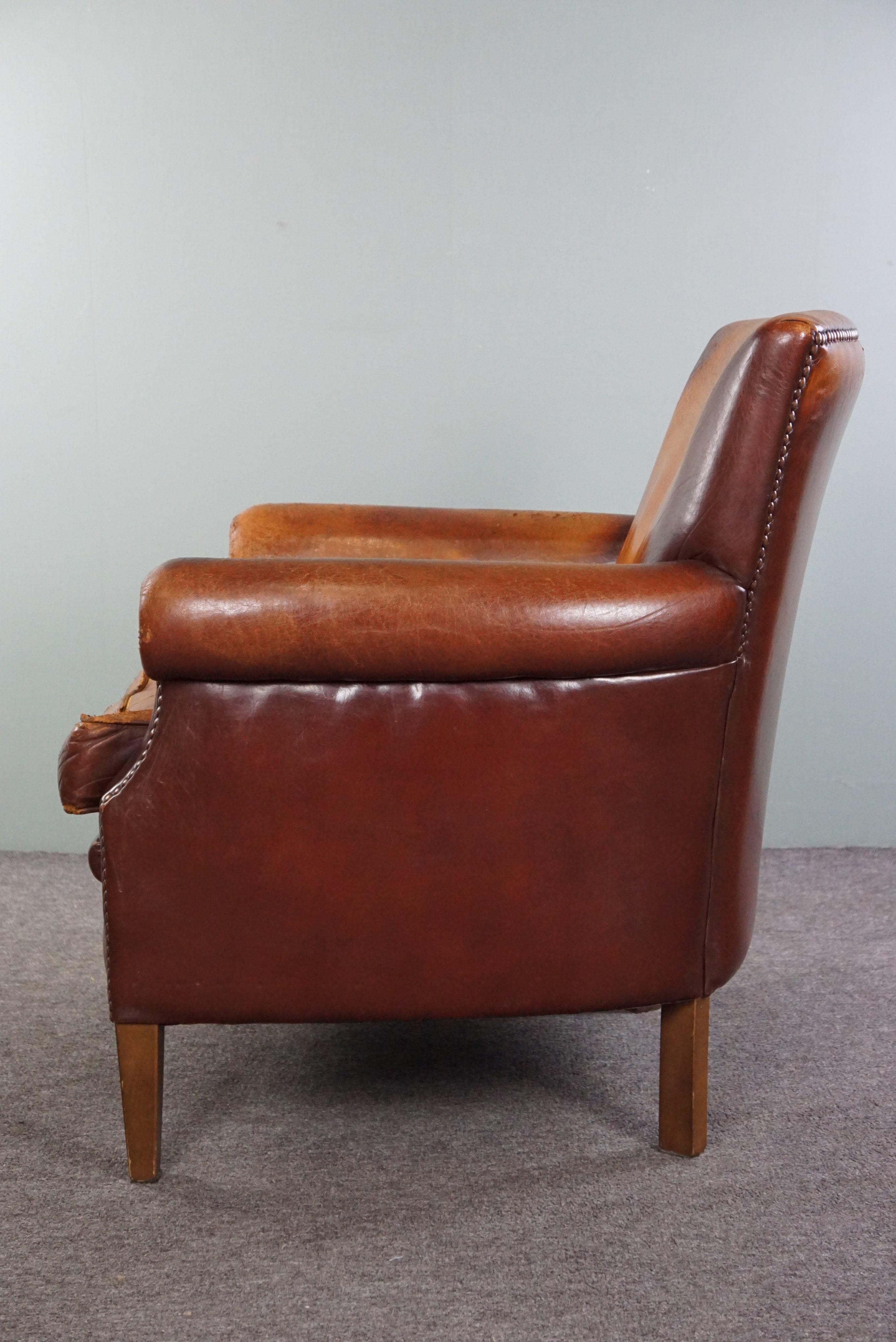 Leather Sturdy sheep leather armchair with a distressed look For Sale
