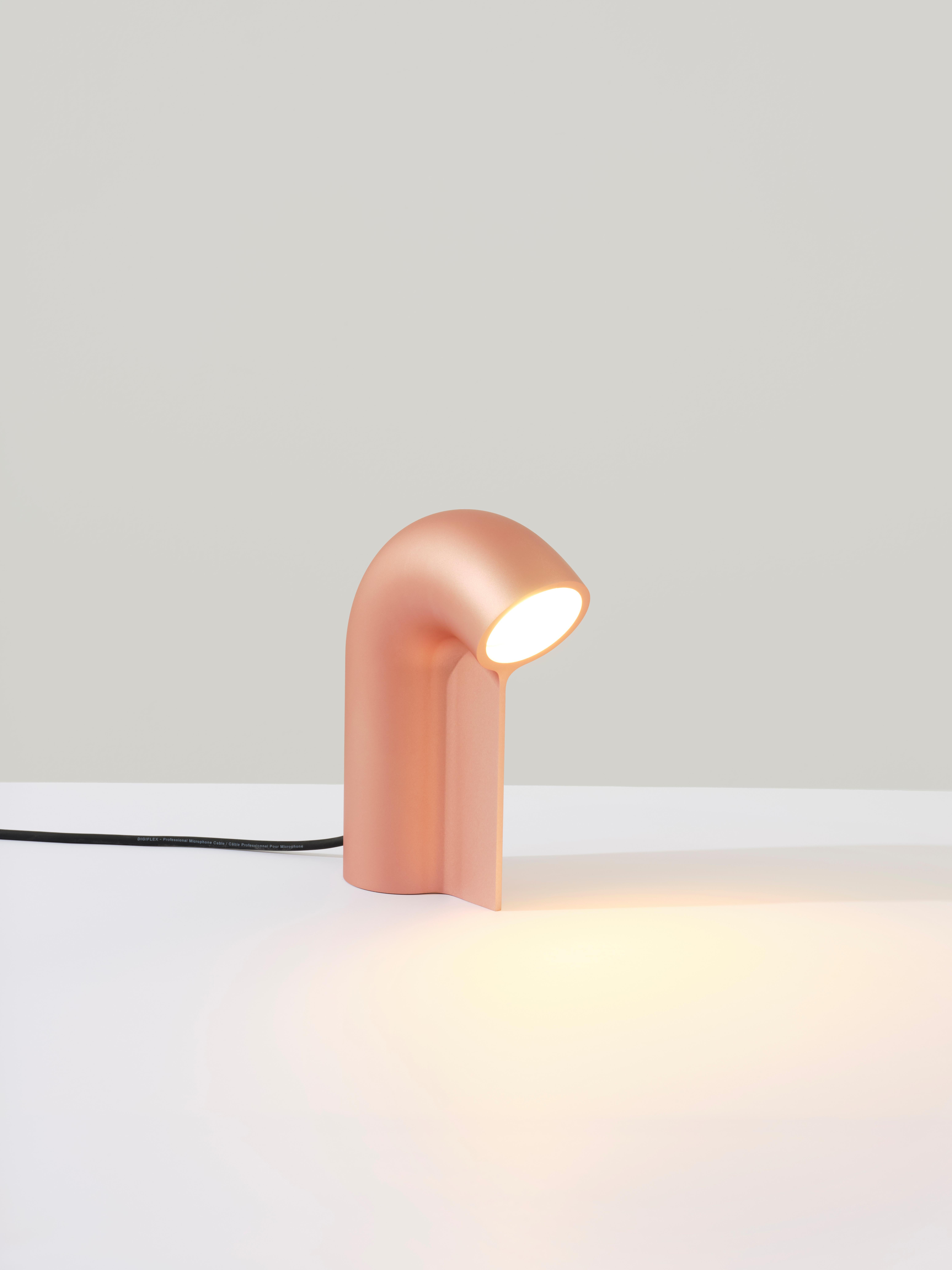Stutter light table lamp by Calen Knauf
Dimensions: D 7.5 x W 17 x H 23.5 cm
Materials: solid anodized aluminum

The Stutter Lamp is milled from a solid block of aluminum using a 5-axis milling machine. Its shape mimics having been cut from a