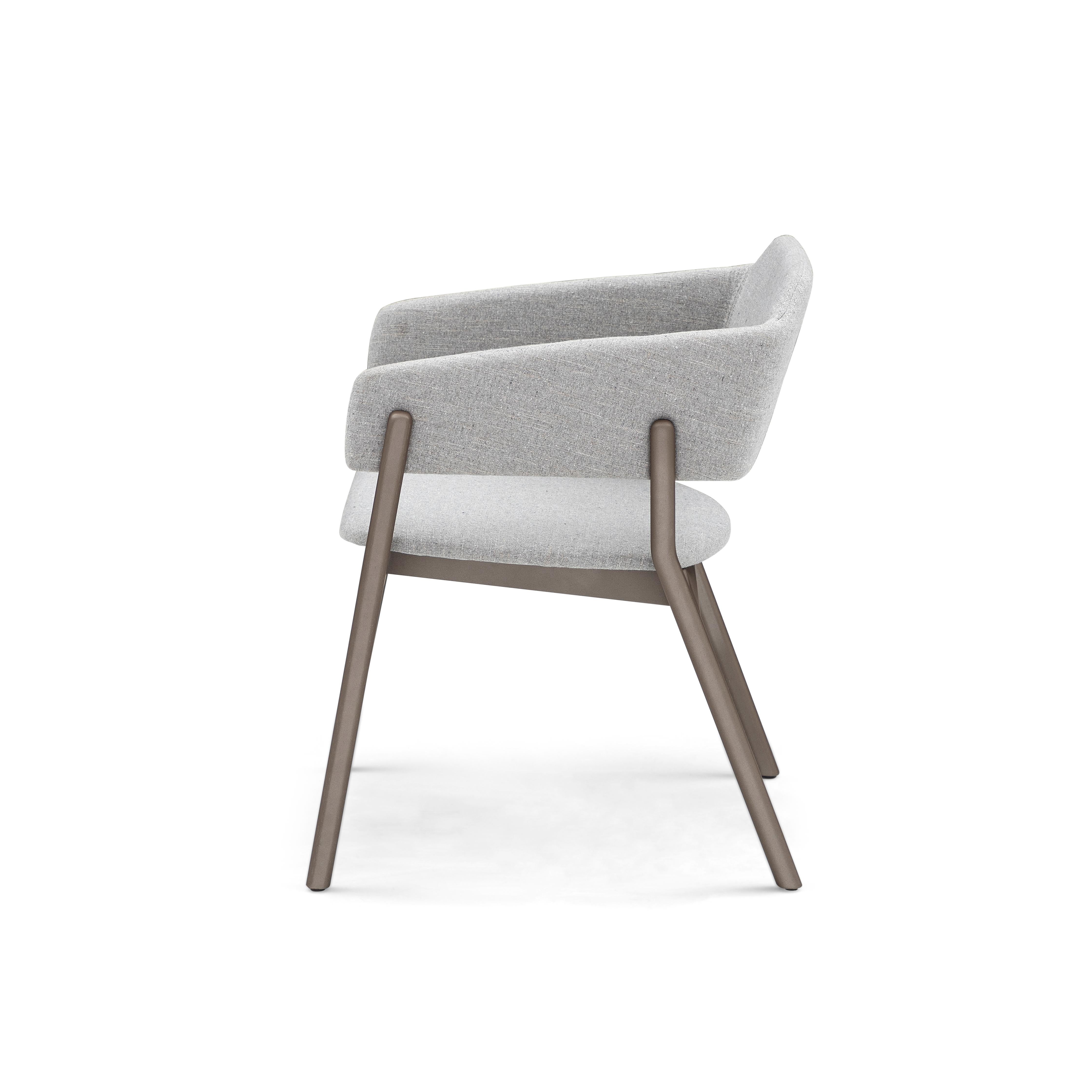 Our Uultis team has created this beautiful Stuzi dining chair to decorate your beautiful dining room table with a beautiful gray fabric and a chocolate or brown wood finish. This chair has a beautifully simple but elegant design that is going to