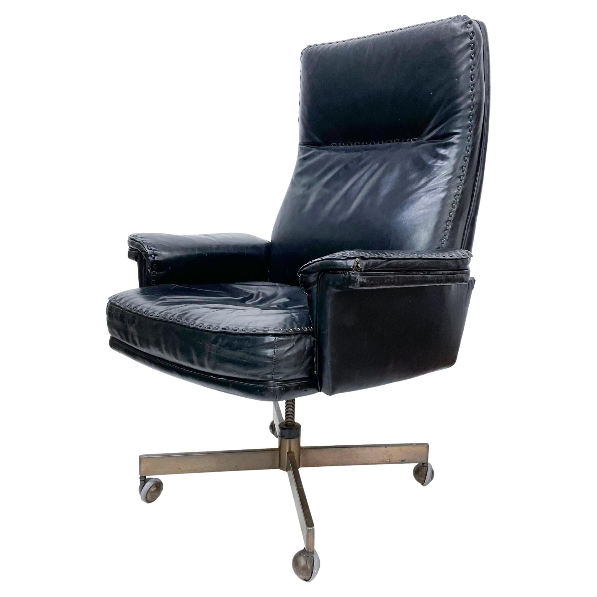 Executive Office Chair 1960s 
Sensational Black Leather Swivel Armchair Whipstitch style of De Sede DS 35
Maker stamped by Classic Leather Inc Hickory Hill, North Carolina
30 W x 46.5 H x 30 D, S 19.5 H adjustable, Arm rest 26 inches
Chair is in