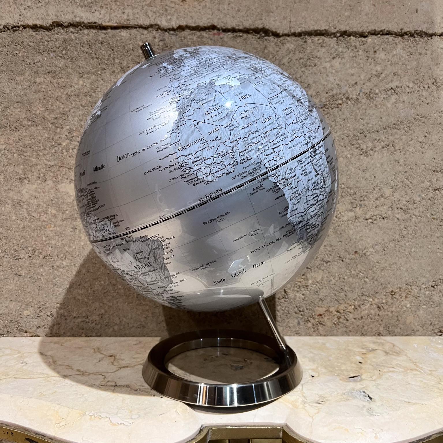 Elegant Silver World Globe in a clean design 
Stable chrome metal base.
Tilted design single axis
Attributed to Drexel Heritage
15 h x 12.5 diameter
Preowned vintage condition
See all images for details.