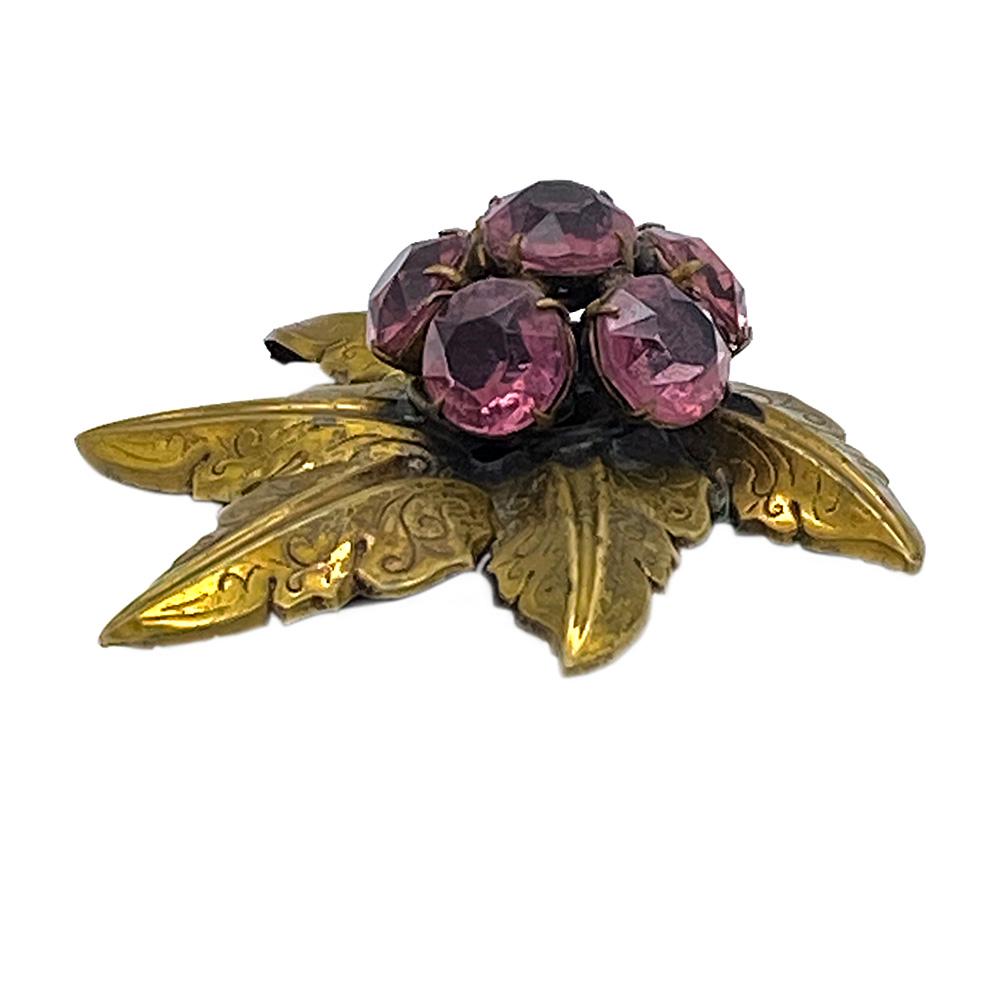 This is a signed Style Metal Spec. N.Y. dress clip that comes with brass stylized maple leaves and prong set faceted ruby red glass berries. This original dress clip could be worn as a pendant, brooch or clip on a clutch. Great holiday