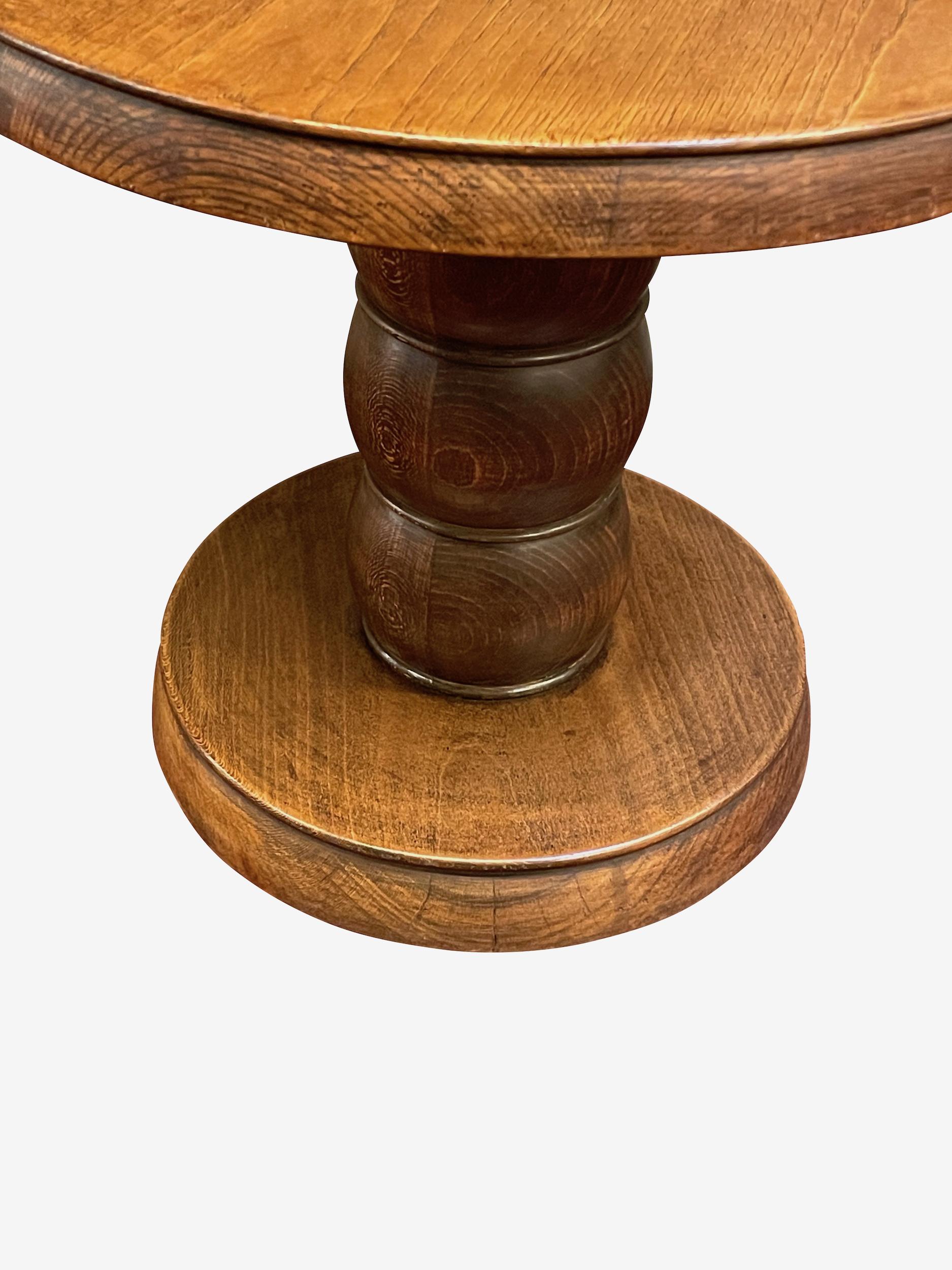 1940s French round side table in the style of Charles Dudouyt.
Stacked three tier donut shapes make up the pedestal base.
Walnut wood.
Two available
Arriving april.