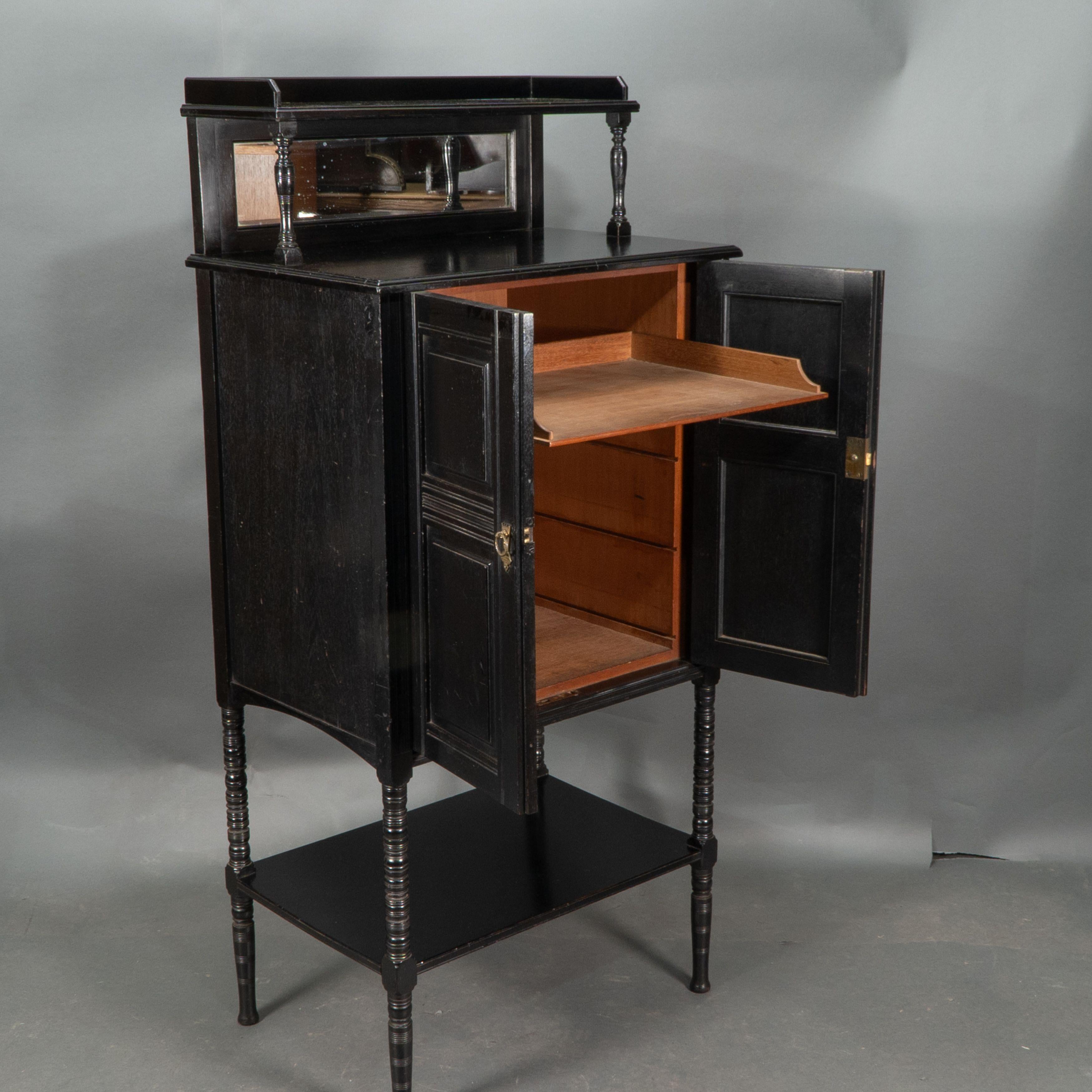 Style of E W Godwin. An Aesthetic Movement ebonized cabinet For Sale 4