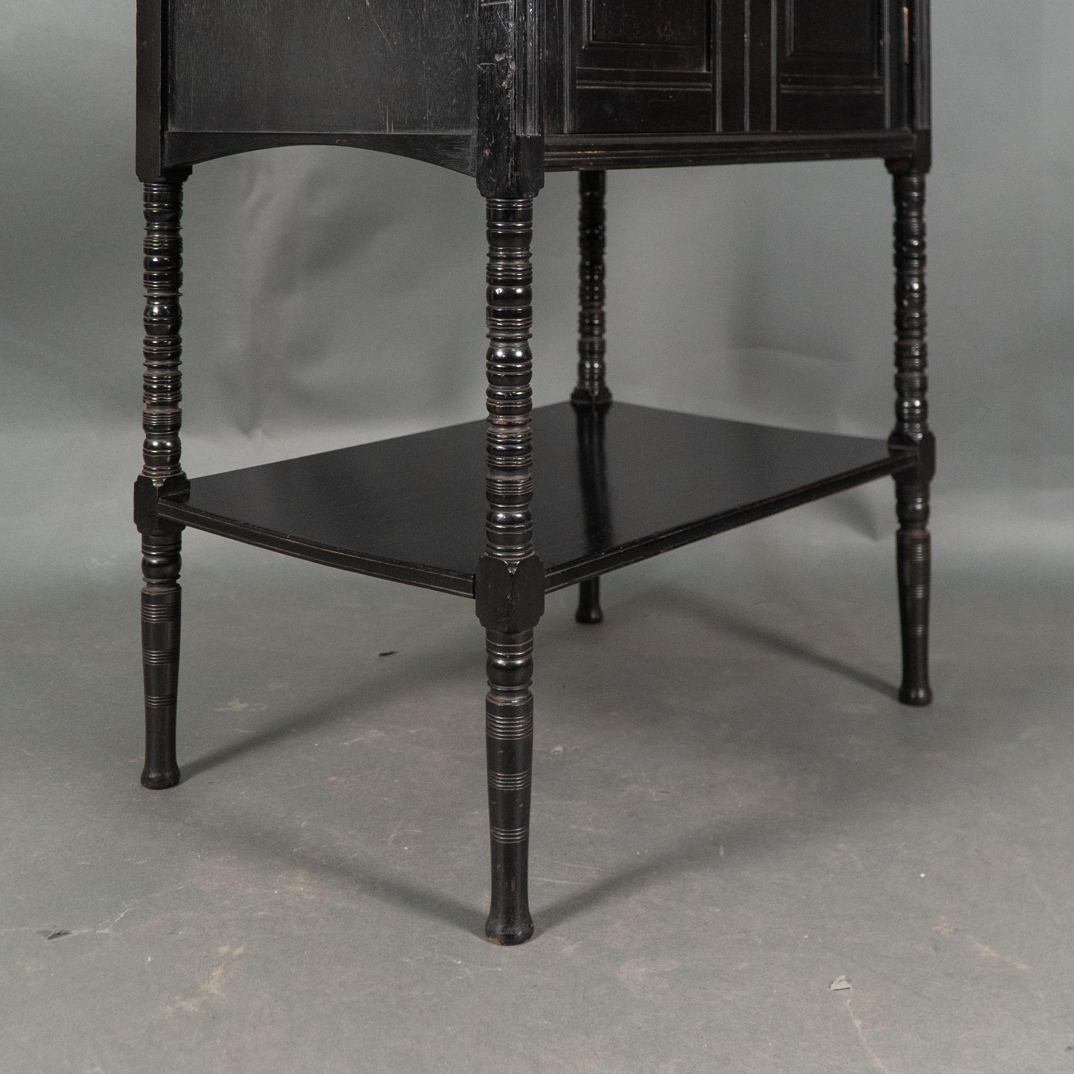 Style of E W Godwin. An Aesthetic Movement ebonized cabinet For Sale 11
