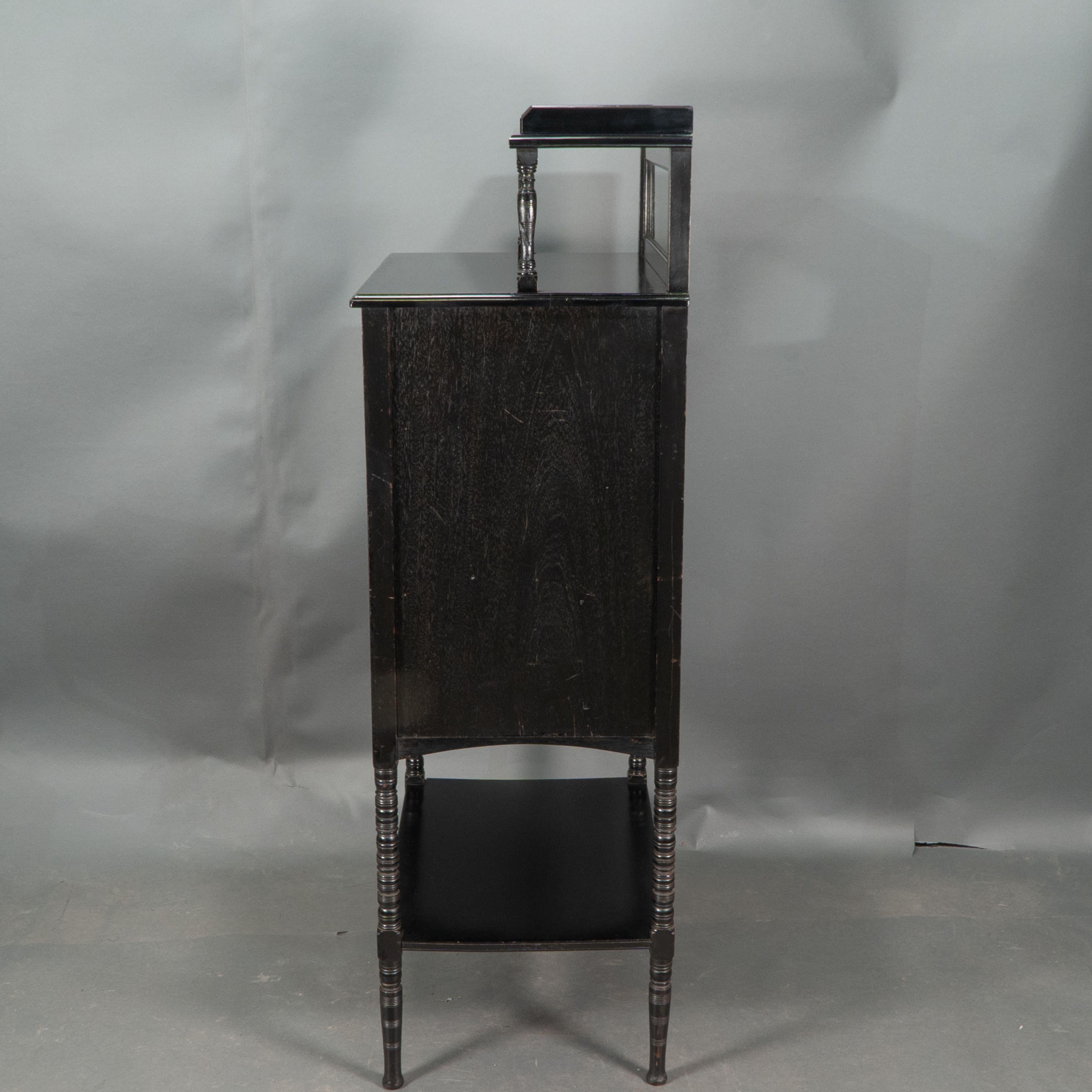 British Style of E W Godwin. An Aesthetic Movement ebonized cabinet For Sale
