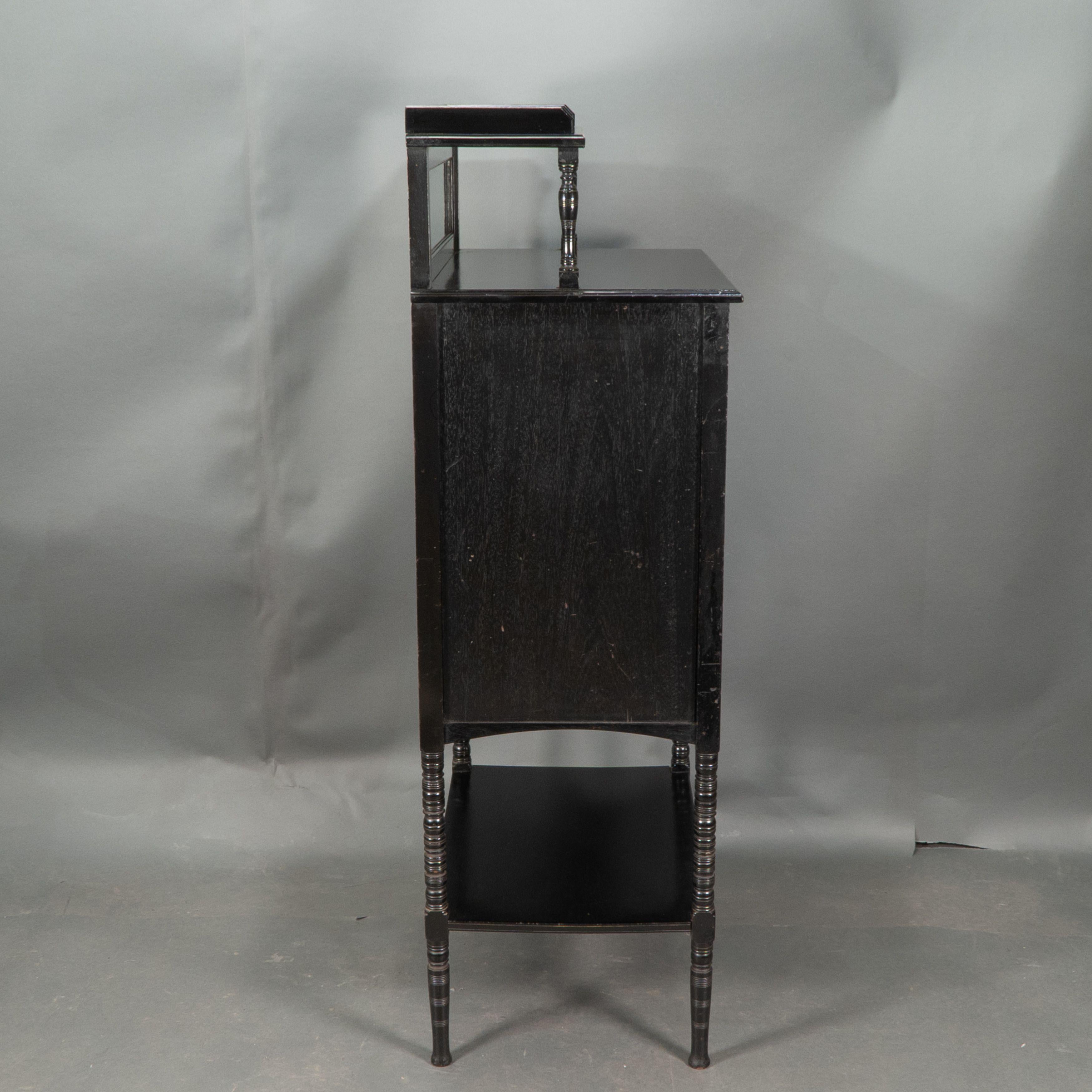 Style of E W Godwin. An Aesthetic Movement ebonized cabinet In Good Condition For Sale In London, GB