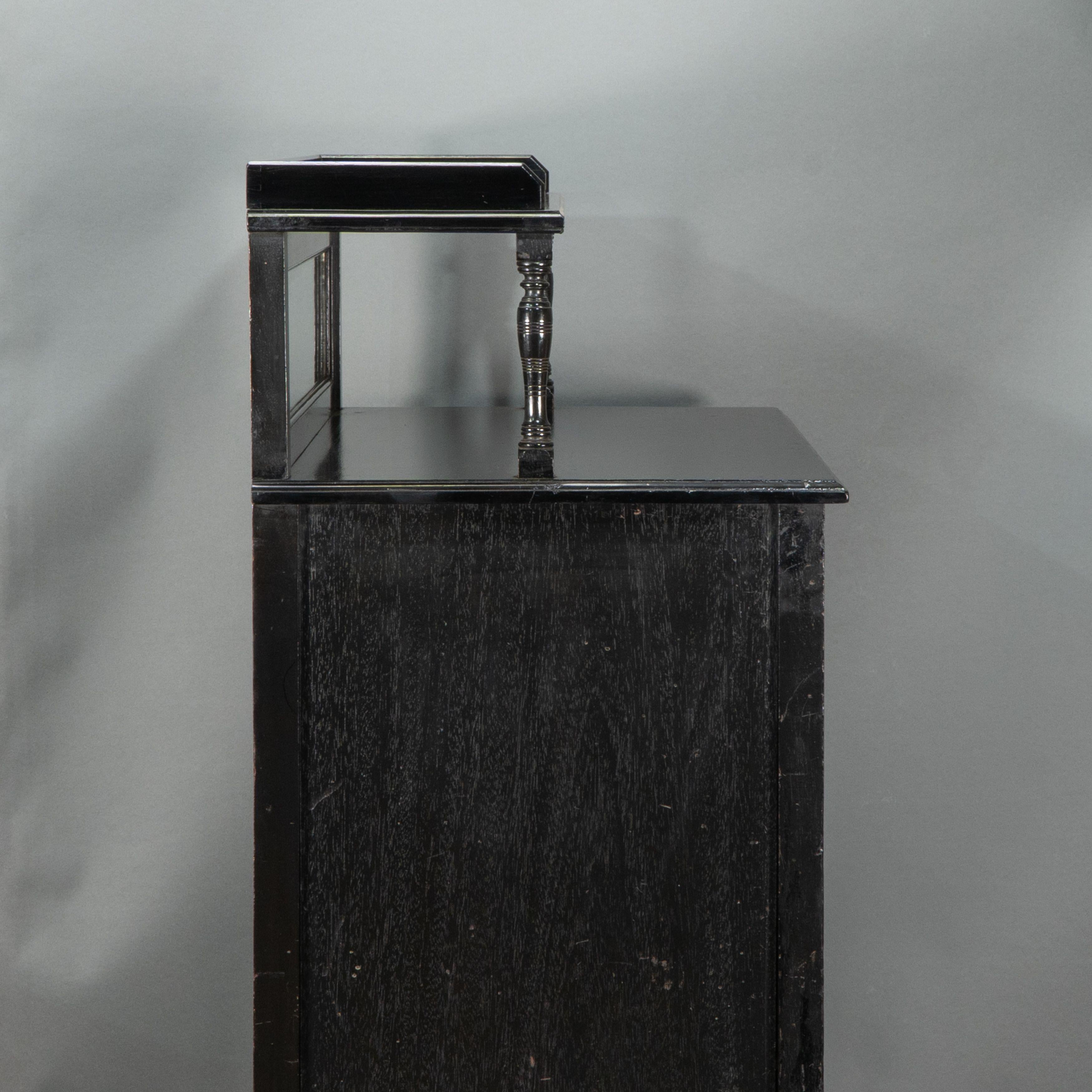 Late 19th Century Style of E W Godwin. An Aesthetic Movement ebonized cabinet For Sale