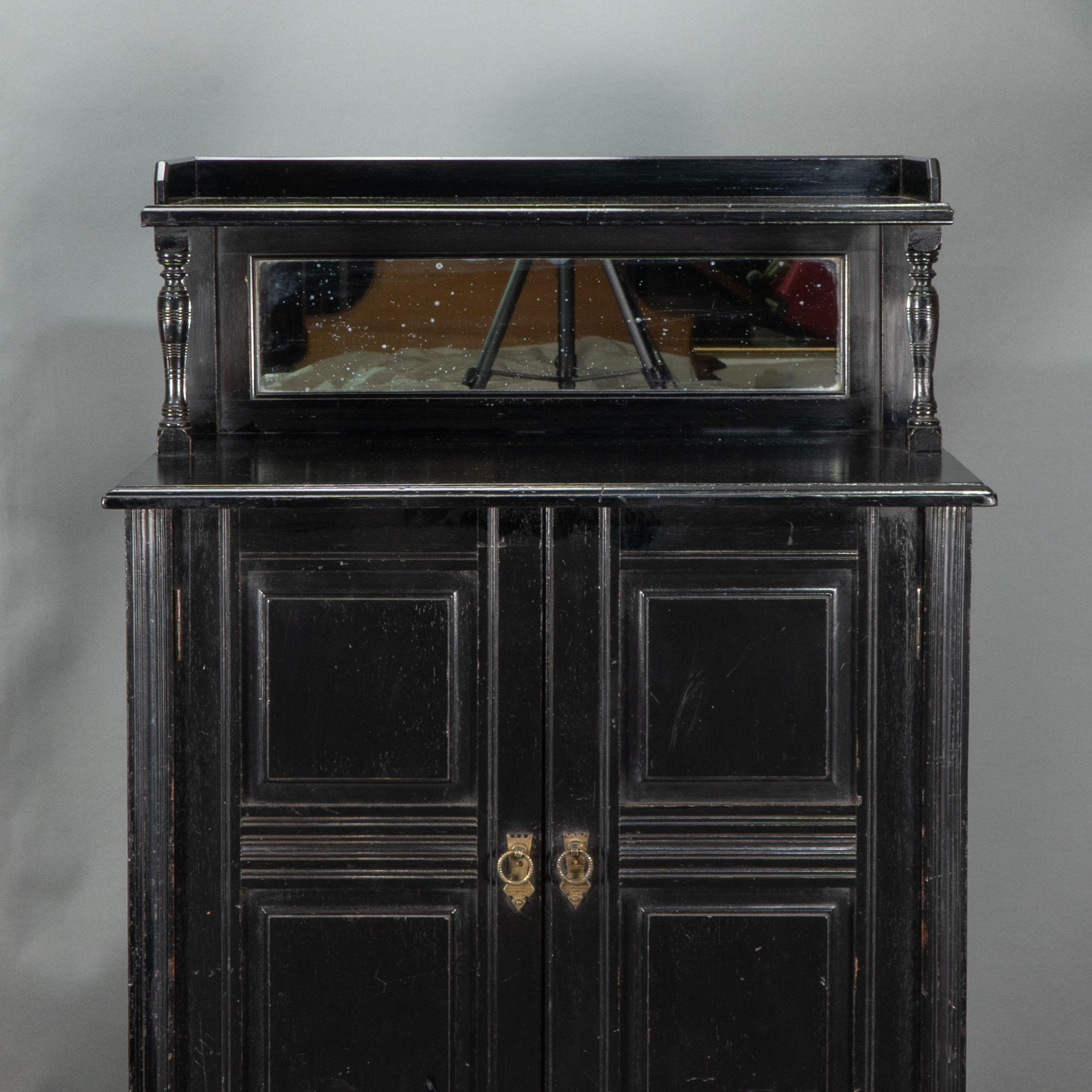 Style of E W Godwin. An Aesthetic Movement ebonized cabinet For Sale 1