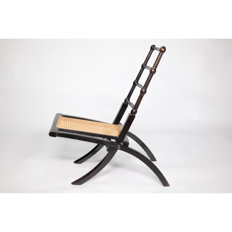 Beech EW Godwin Style of. Aesthetic Movement ebonized folding chair with new cane seat For Sale