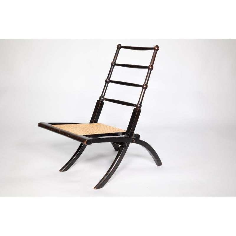 EW Godwin Style of. Aesthetic Movement ebonized folding chair with new cane seat For Sale 1
