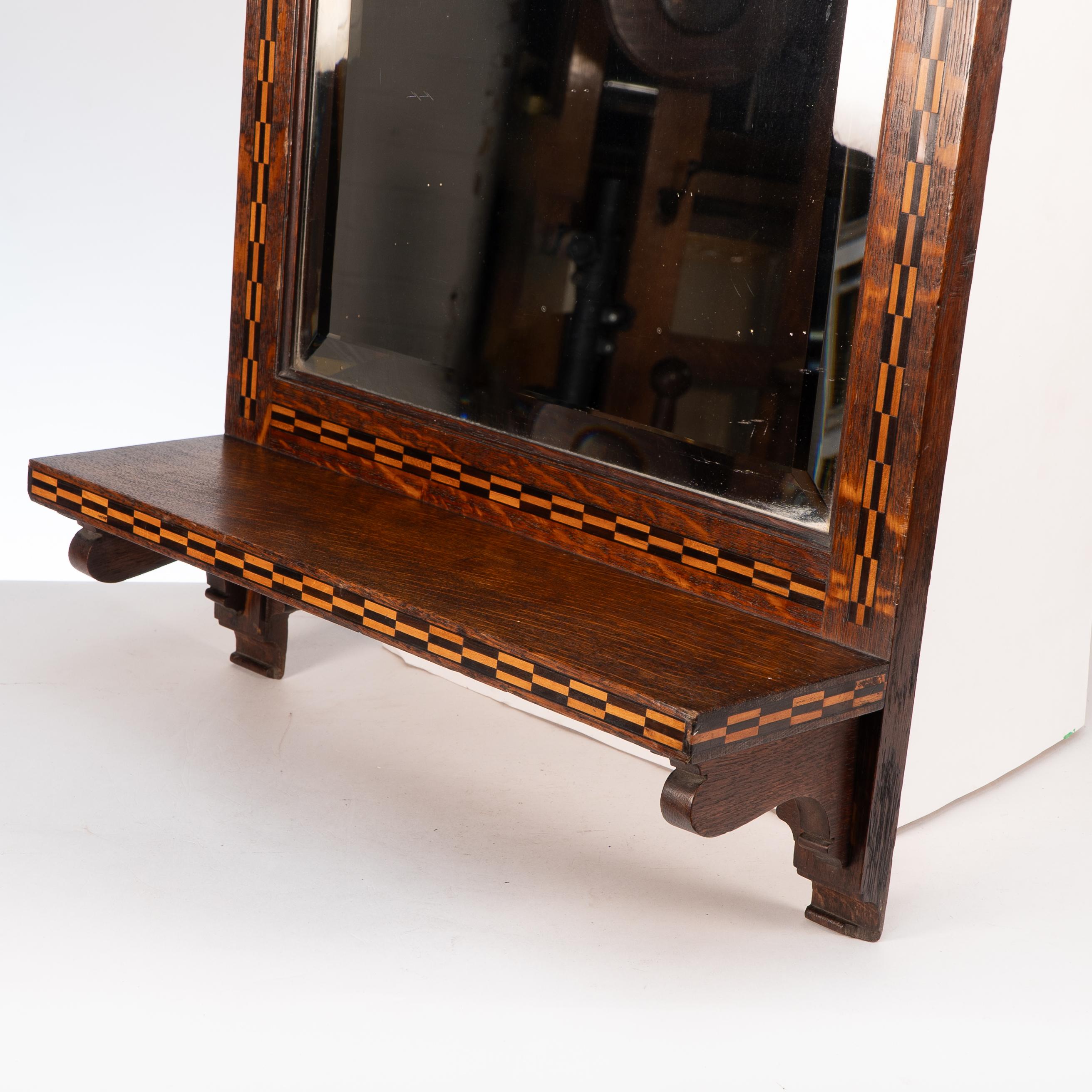 English Style of M H Baillie Scott an Arts & Crafts Oak Mirror with Chequer Inlays