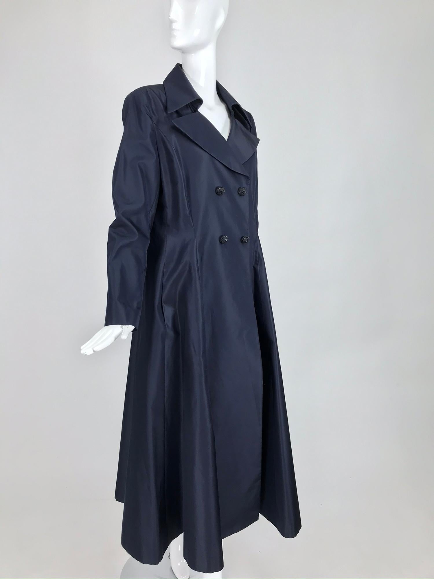 Style Paris navy blue silk evening coat. Style Paris is a luxury women’s wear brand available exclusively at their boutiques in Palm Beach, New York. Their collection remains entirely made in France, where their Atelier also produces for companies