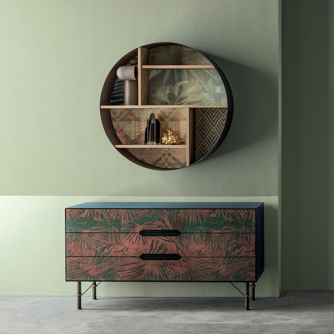 The style pink leaf sideboard makes a refreshing addition to the hallway or living room, boasting a vibrant pink and green tropical print. Its three drawers are equipped with cutout handles for a sleek, streamlined aesthetic. Crafted from solid